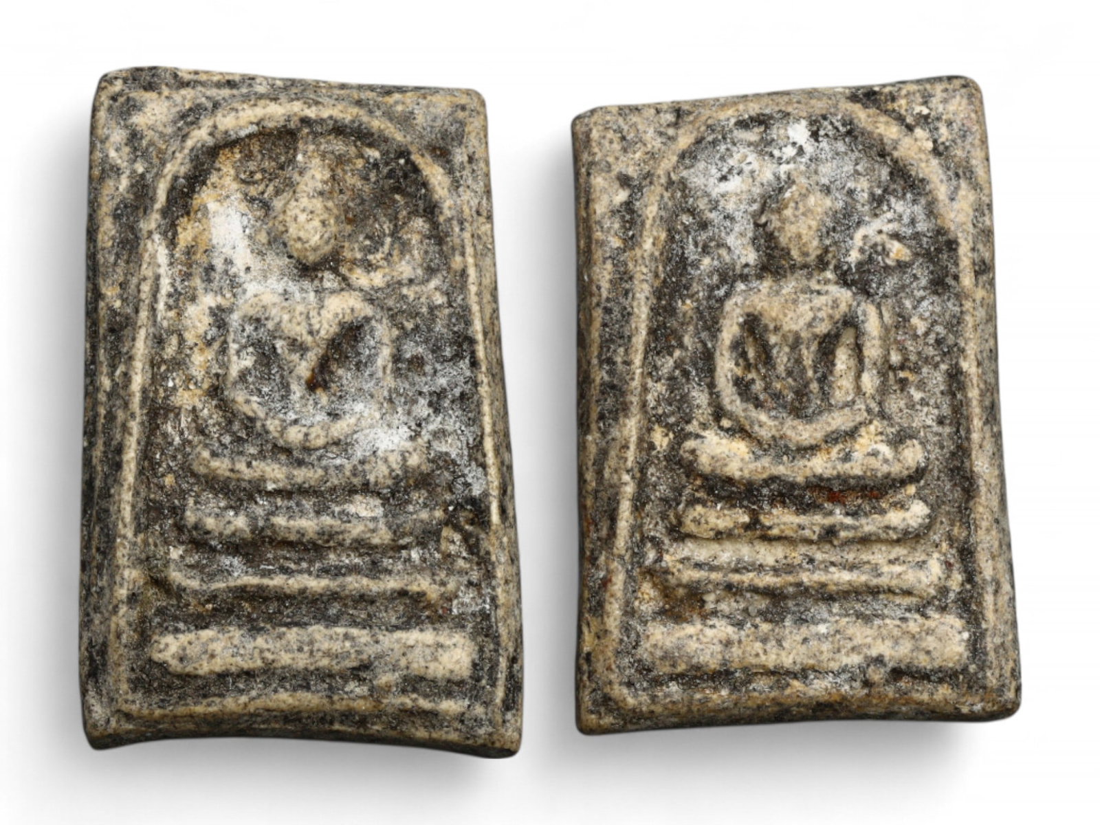 Antique Thai Meditation Buddha Amulet Pair in Grey Clay, 18th-19th Century, 3.5-3.8cm, 15g: This contemplative pair of antique Thai amulets, delicately formed from grey and speckled mineral-rich clay, exemplifies the spiritual minimalism and devotional craftsmanship of 18th to 19th century B