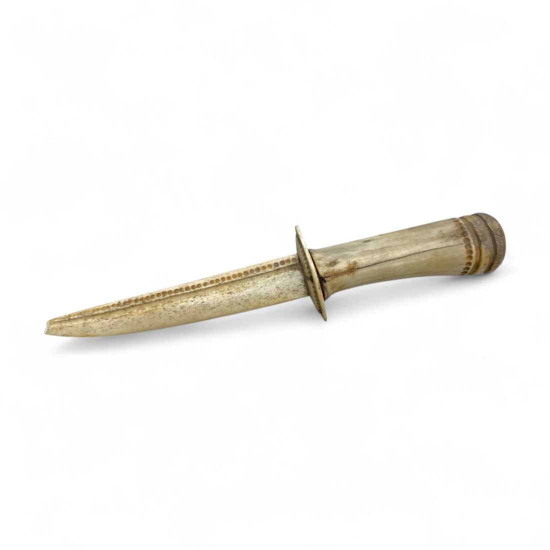 Ancient Medieval Near Eastern Ceremonial Dot-Incised Bone Dagger, c. 9th-13th Century CE - 122g: This finely carved ceremonial dagger originates from the Near Eastern world during the medieval Islamic era, dated approximately to the 9th-13th century CE. Crafted entirely from bone, the piece measu