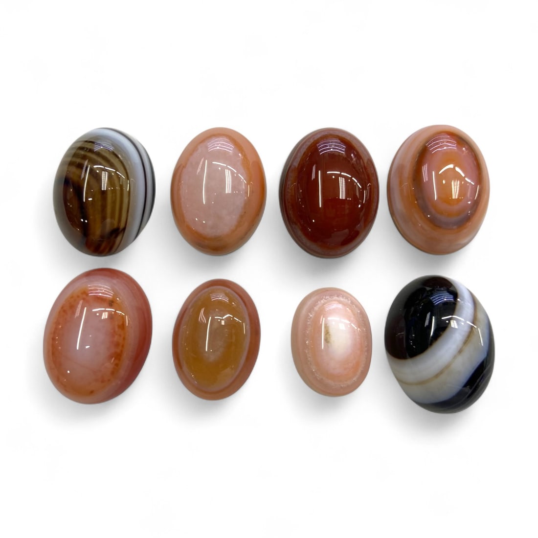 Vintage Near Eastern Agate and Sardonyx Oval Cabochon Collection, Mid-20th Century, 28g: This elegant set of eight polished oval cabochons showcases the natural splendor of agate and sardonyx, popular semi-precious stones deeply valued in Near Eastern and Mediterranean cultures since anti