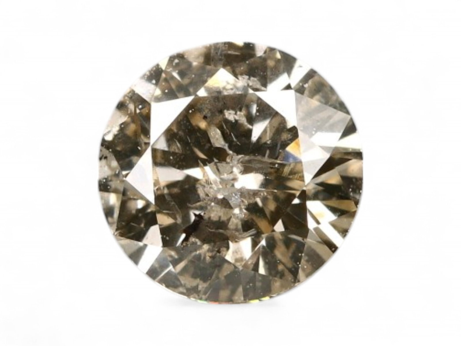0.54ct Natural FANCY SILKY CHAMPAGNE Round Diamond, 5.2mm: This 0.54 carat natural round diamond reveals a soft champagne tone with a refined, silky luster. Measuring 5.2mm, it features a subtle golden-bronze hue with delicate internal feathering that enhance