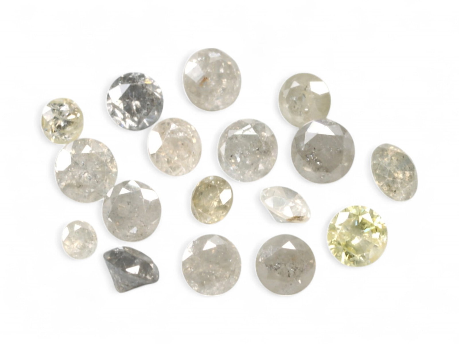 1.04ct Lot of NATURAL ROUND Fancy Diamonds - Soft Champagne, Grey & Pale Yellow Tones (17pcs): This curated parcel of 17 all round-cut natural diamonds offers 1.04 carats of elegant variation-ranging from whisper-soft champagne and pale yellow to misty greys and salt-and-pepper tones. Unified b
