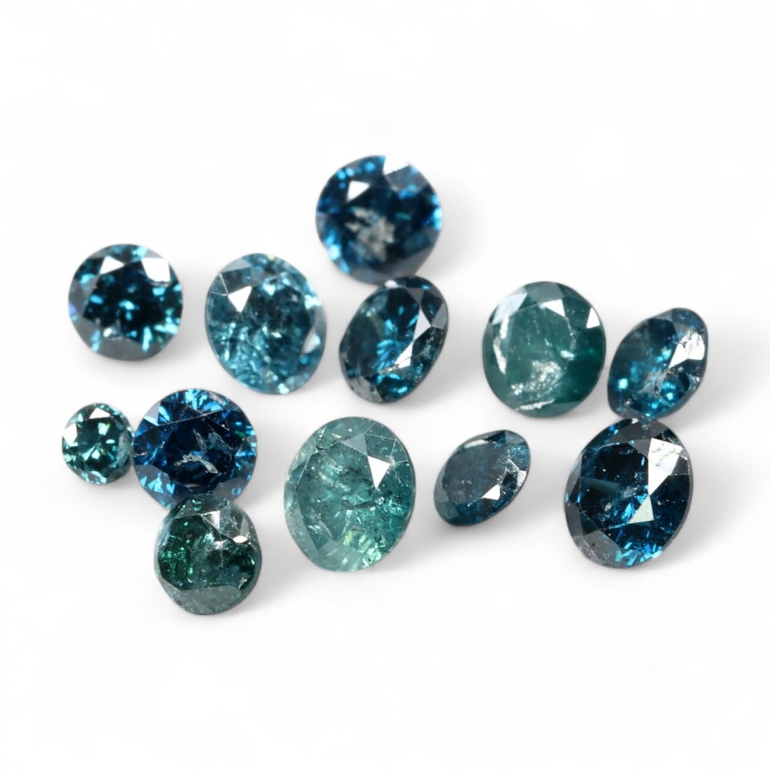 1.03ct Irradiated FANCY DEEP BLUE-GREEN Round Diamond Parcel (11pcs): A striking 11-piece parcel totaling 1.03 carats, this collection of round-cut natural diamonds has been professionally irradiated to achieve a captivating range of fancy deep blue-green tones. From st