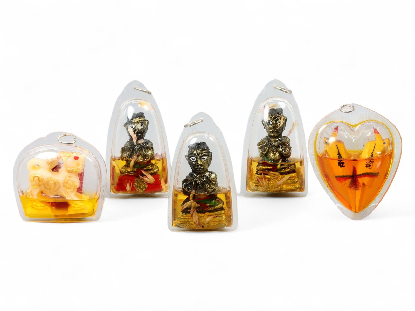 Vintage Thai Occult Charm Amulet Set in Resin Capsules, Erotic and Tantric Themes, 83g: This striking set of five vintage Thai occult amulets reflects the enigmatic world of Southeast Asian spiritualism, where mysticism, sensual symbolism, and protective energies intertwine. Encased in c