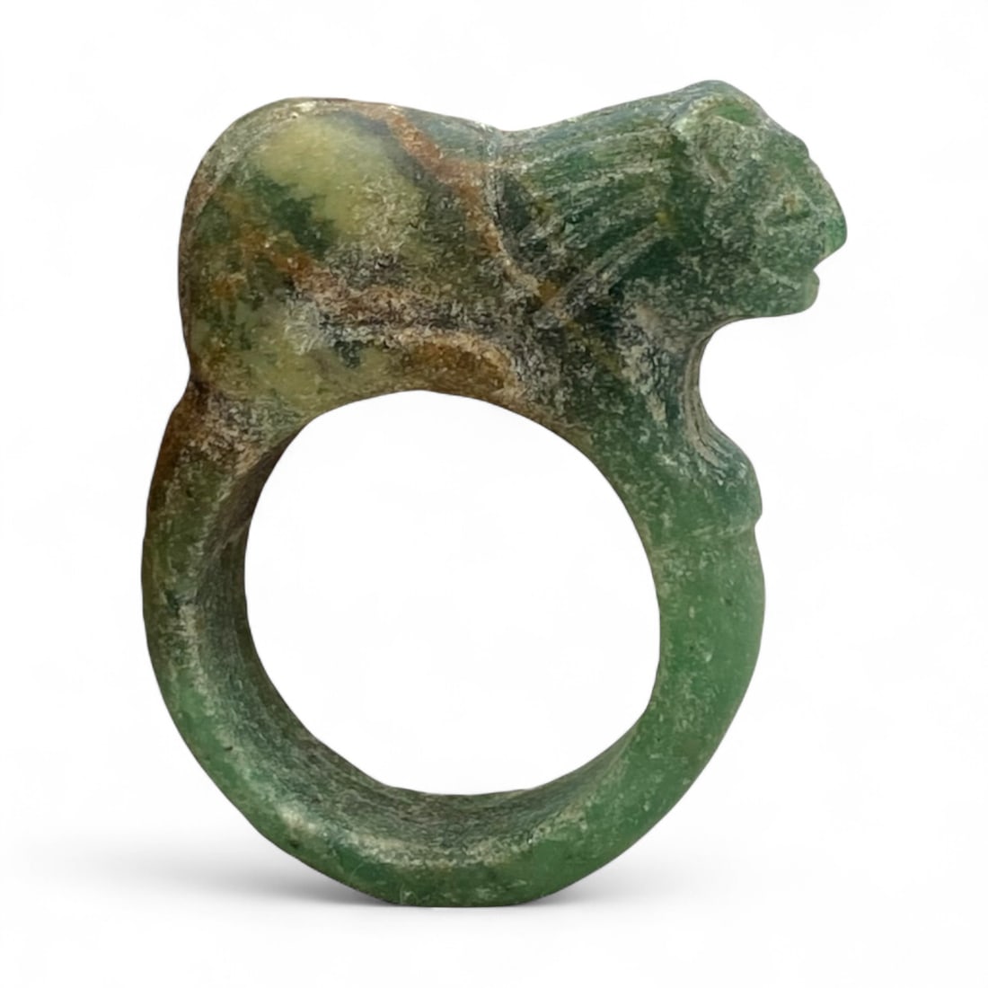 Ancient Near Eastern Lion-Form Green Stone Ring, Symbol of Power, 4cm, 17g: This captivating ring, carved from richly variegated green stone, exemplifies the symbolic artistry of the ancient Near East. Shaped in the form of a lion poised above the band, it embodies the timele