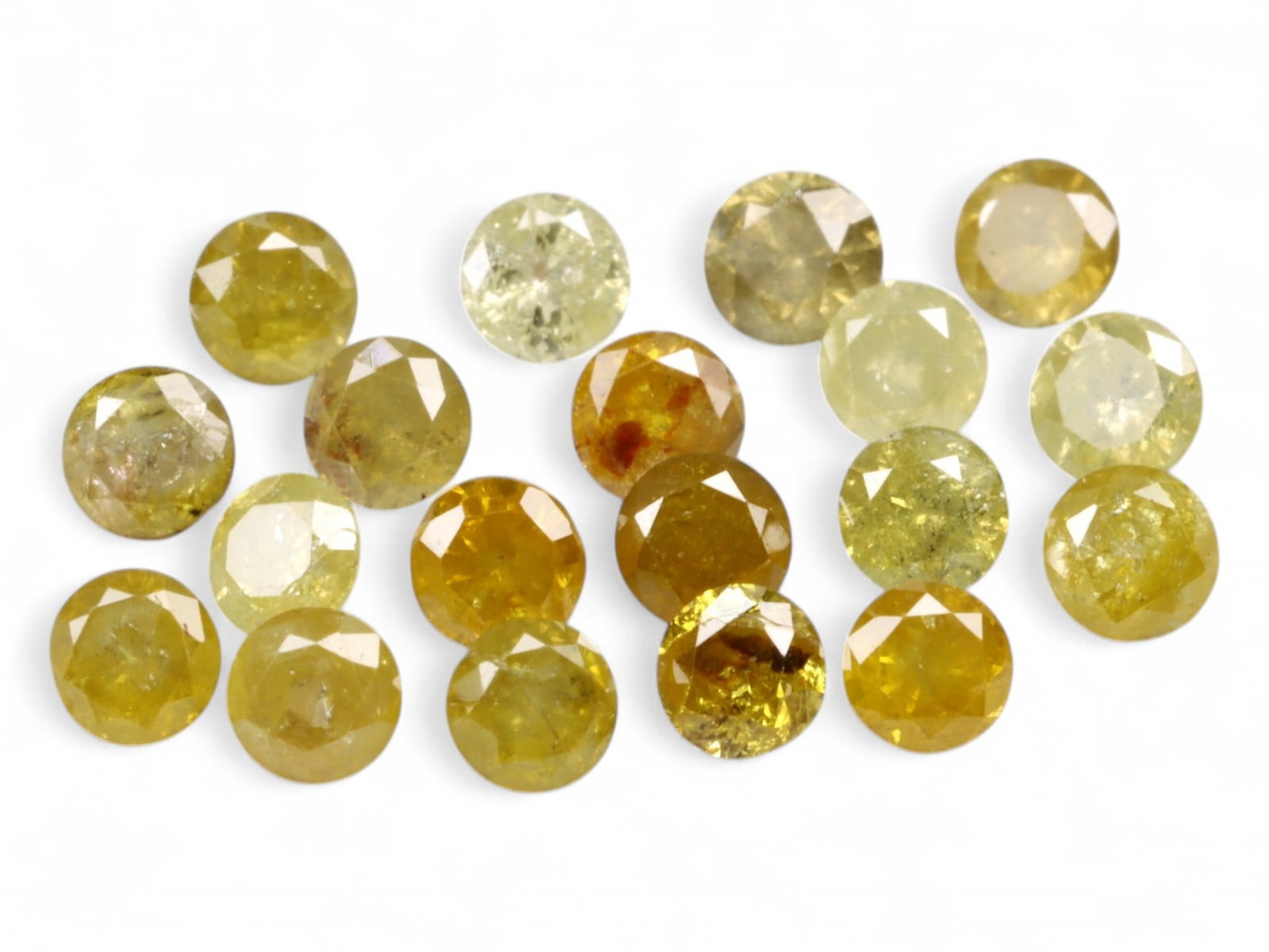 1.04ct Natural FANCY GREYISH YELLOW Diamond Lot - Round Cut: A subtly radiant parcel, this curated lot of natural round-cut diamonds displays an organic palette of greyish yellow tones with varied translucency and natural internal textures. The warm-to-cool spe