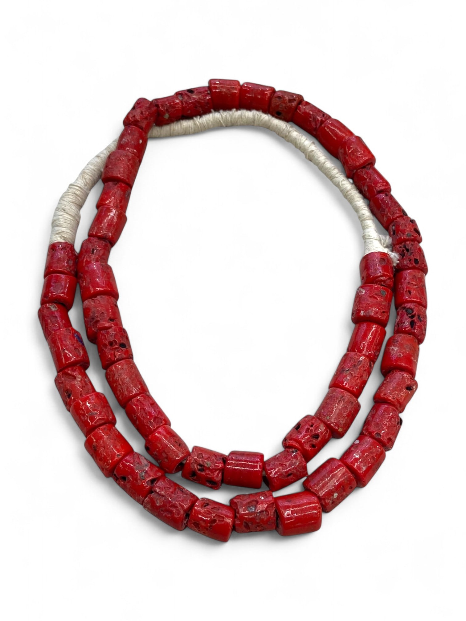 Antique Venetian Trade Red Glass Bead Strand, c. 18th-19th Century CE, 123g: This vibrant antique strand features striking red cylindrical glass beads, likely originating from Venice during the height of its glassmaking and trade influence in the 18th to 19th centuries CE. The