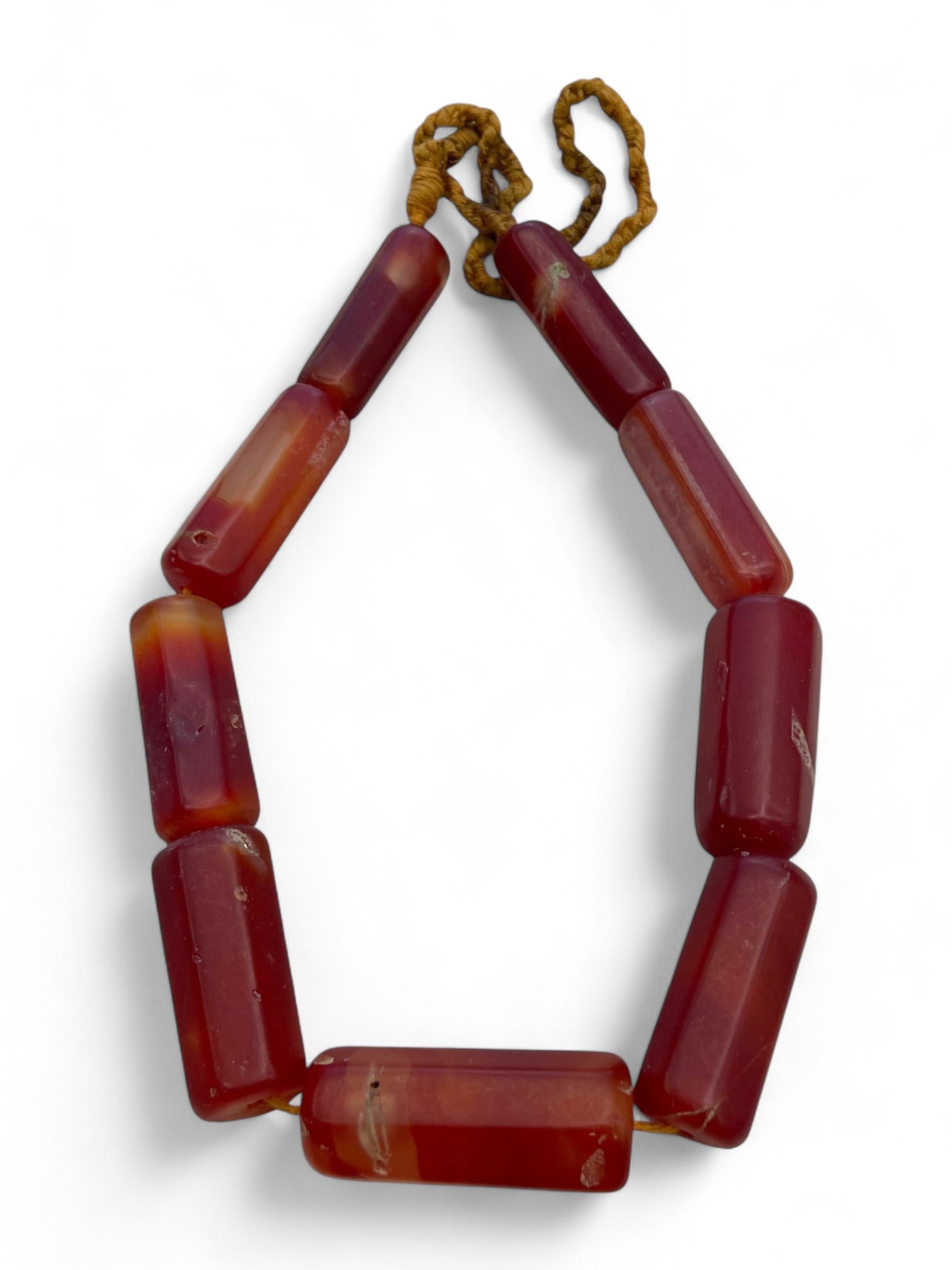Antique Central European Cylindrical Carnelian Bead Strand, c. 18th-19th Century CE, 136g: This striking strand of antique carnelian beads hails from Central Europe, most likely Germany, and dates to the 18th or 19th century CE. The deep, rich red hues and elegant translucence of the stone 