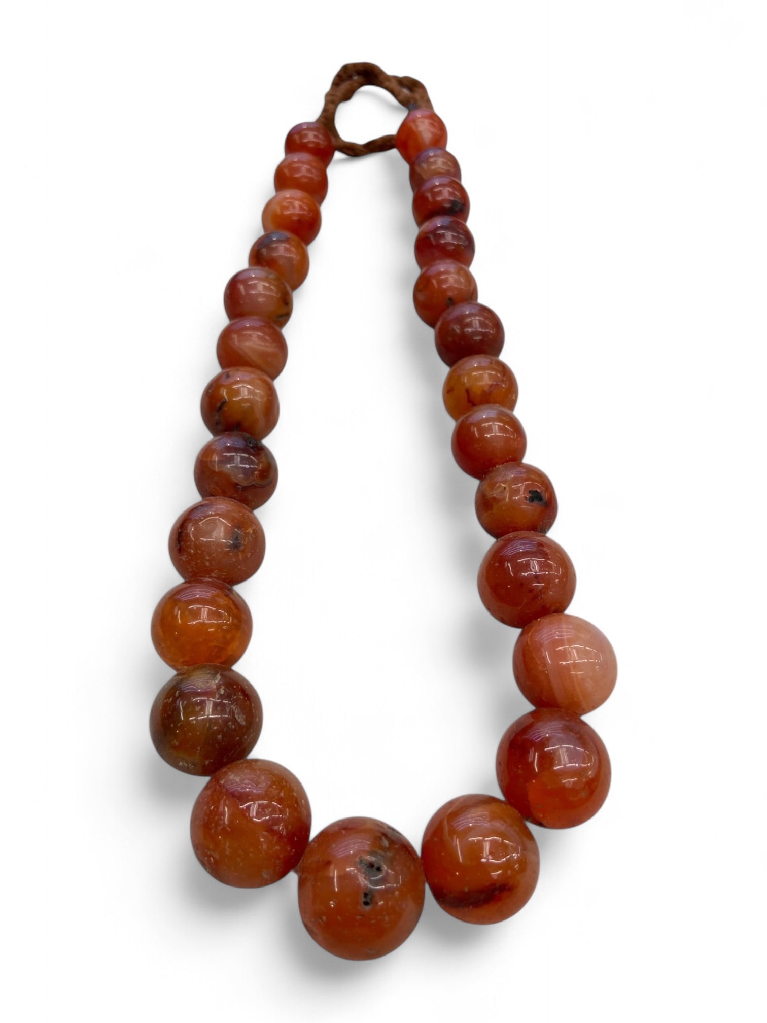 Antique Near Eastern Carnelian Power Bead Strand Necklace, Symbol of Vitality and Trade, 220g: This bold strand of antique carnelian beads likely hails from the Near East or Central Asia, dating to the late 19th or early 20th century. Crafted in a style reminiscent of ancient lapidary tradition