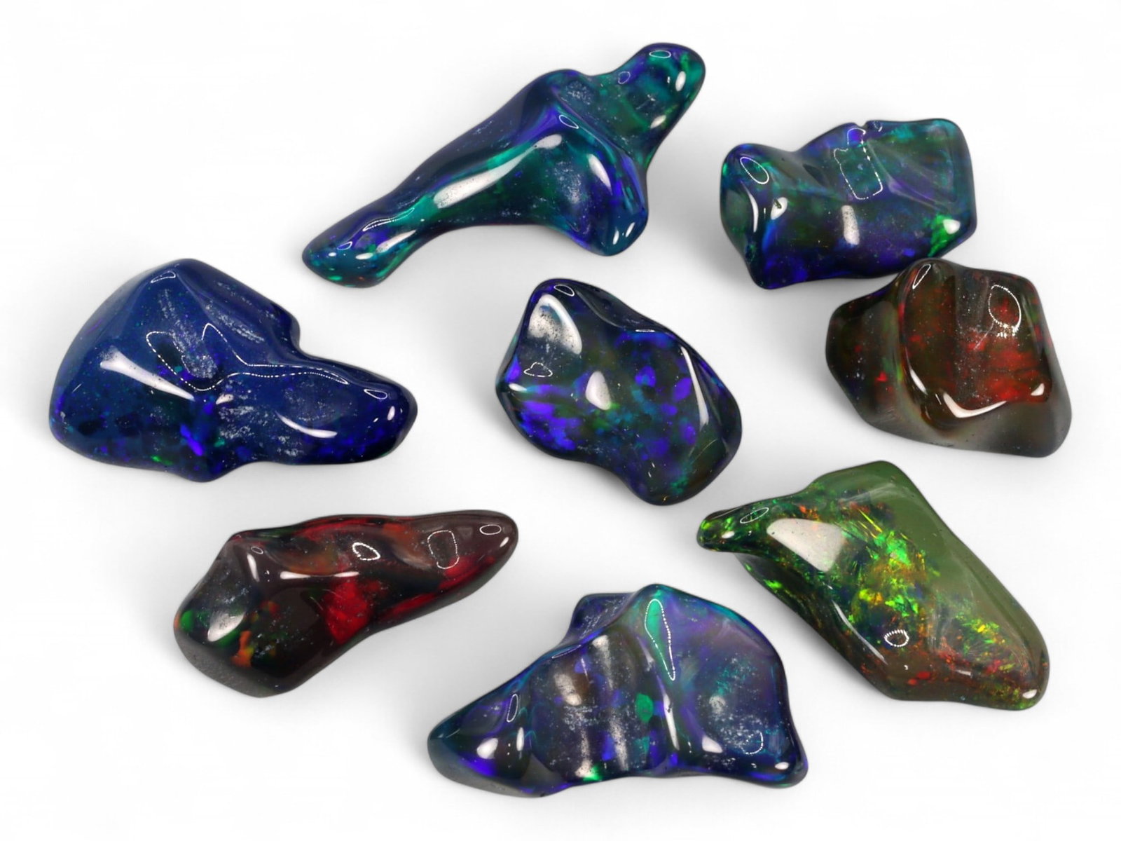 24.40Ct Natural ETHIOPIAN WELO Black Smoked Opal Polished Rough Parcel Lot: This parcel of polished rough Ethiopian Welo black smoked opal captures the untamed beauty and spectral intrigue of natural opal in its most organic form. Each freeform piece reveals a moody, darkened