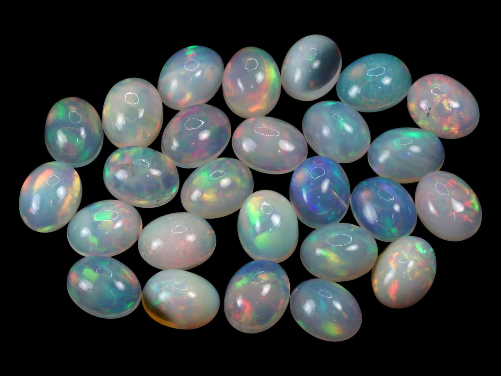 30.80Ct Natural ETHIOPIAN WELO White Opal Cabochon Parcel Lot: A luminous parcel of natural Ethiopian Welo white opals, each cabochon reveals an ethereal interplay of pastel brilliance within a translucent to milky-white body. The internal fire dances in flashes 