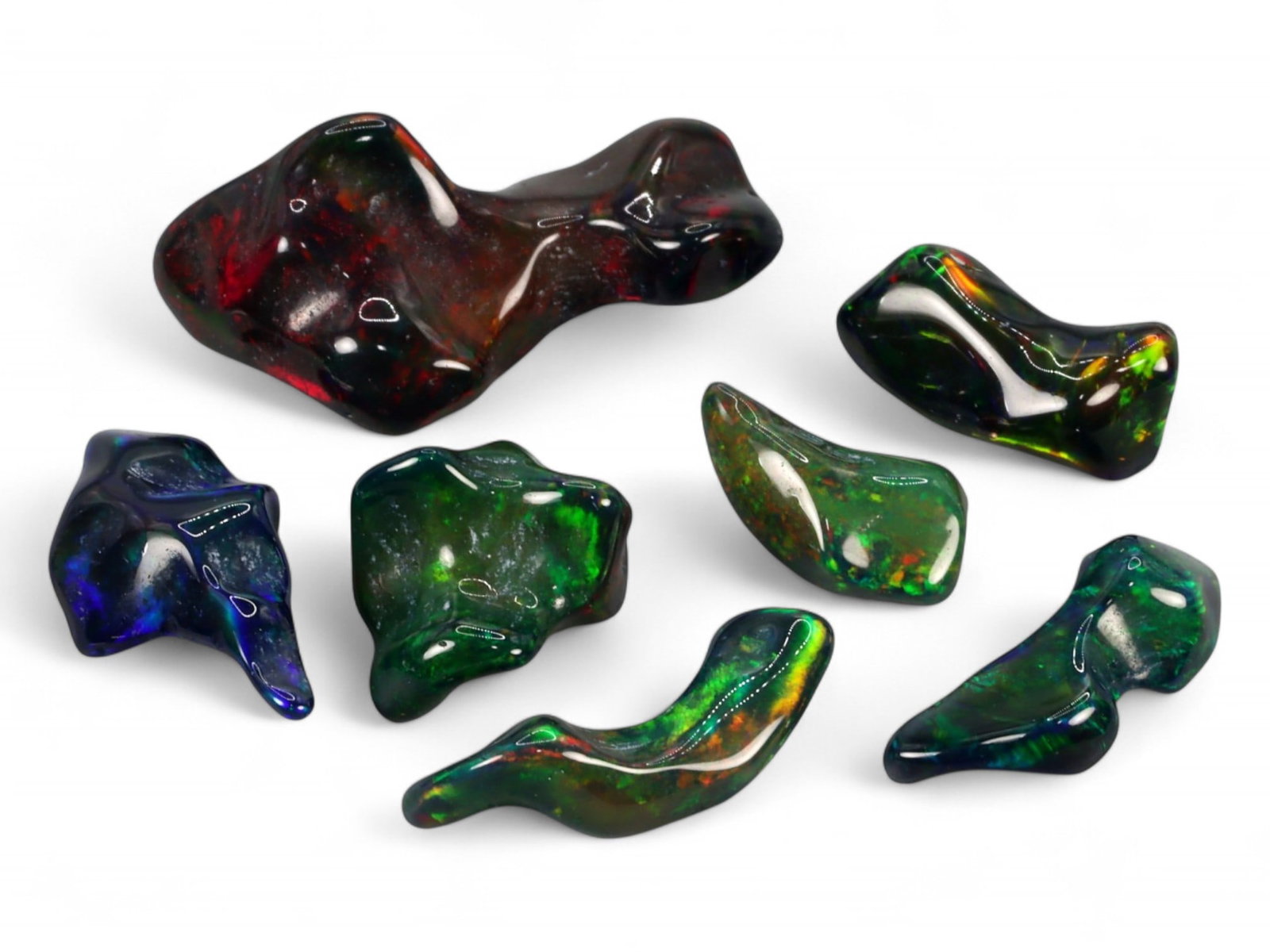 18.10Ct Natural ETHIOPIAN WELO Black Smoked Opal Polished Rough Parcel Lot: This parcel of polished rough Ethiopian Welo black smoked opal captures the untamed beauty and spectral intrigue of natural opal in its most organic form. Each freeform piece reveals a moody, darkened