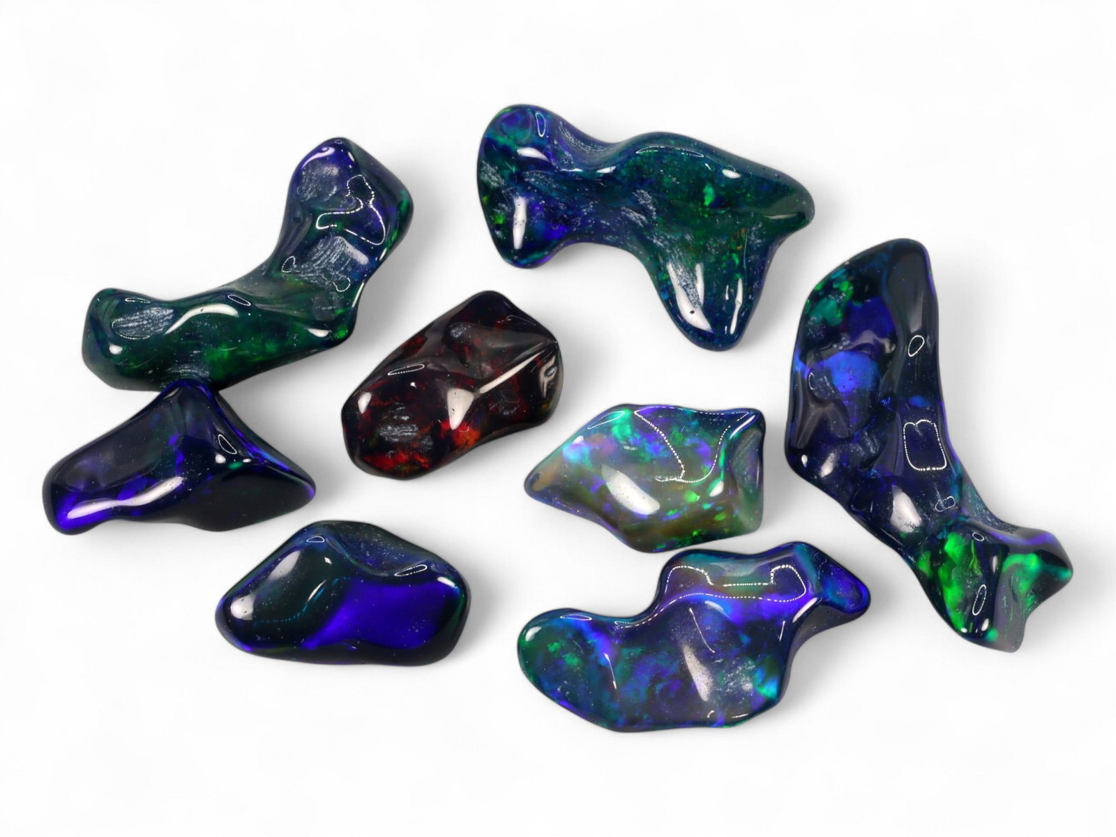 25.40Ct Natural ETHIOPIAN WELO Black Smoked Opal Polished Rough Parcel Lot: This parcel of polished rough Ethiopian Welo black smoked opal captures the untamed beauty and spectral intrigue of natural opal in its most organic form. Each freeform piece reveals a moody, darkened