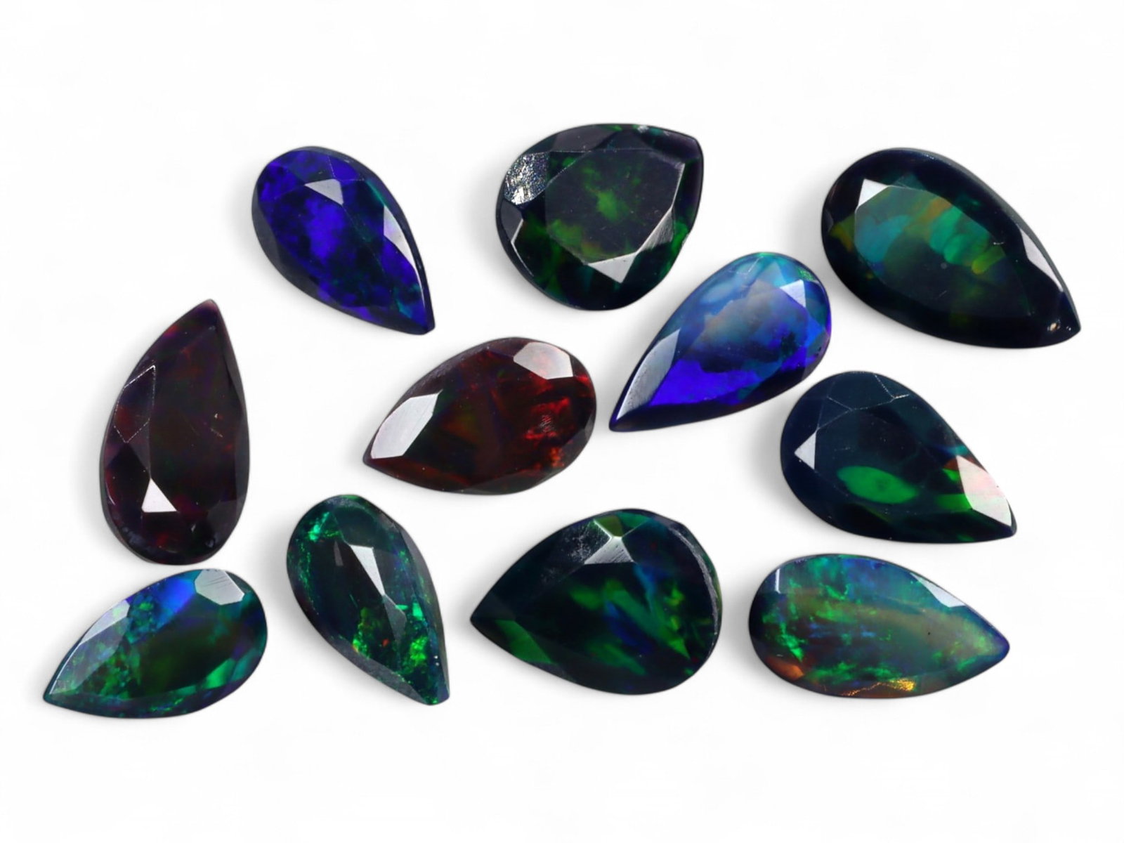 10.40Ct Natural ETHIOPIAN WELO Black Smoked Opal Faceted Parcel Lot: An alluring array of natural Ethiopian Welo black smoked opals, this parcel radiates with spectral fire and deep iridescence. Each gem is richly faceted to enhance the dynamic play-of-color-ranging fr