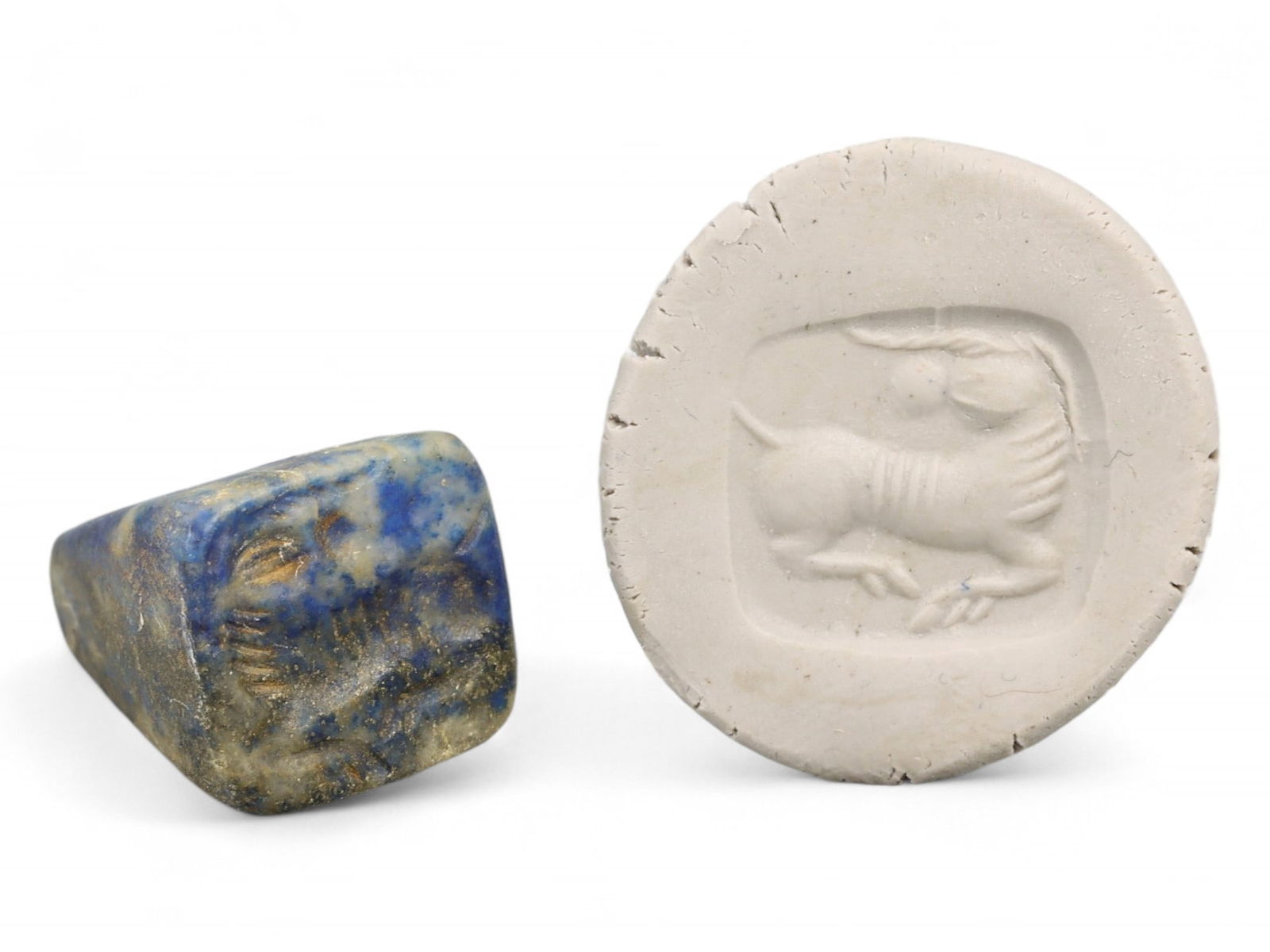 Ancient Elamite Reclining Stag Motif Lapis Lazuli Stamp Seal, c. 2200-1800 BCE, 9g: This distinctive triangular stamp seal, carved from deep blue lapis lazuli with golden pyrite inclusions, dates to the Elamite period of the late 3rd to early 2nd millennium BCE. Weighing 9 grams and