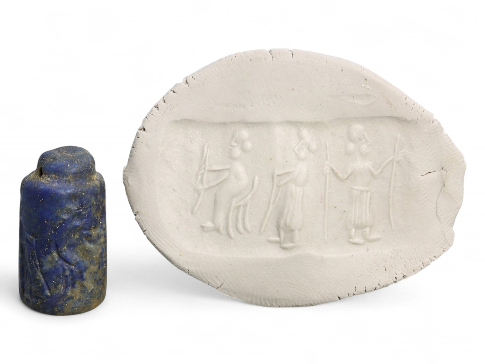 Ancient Akkadian Three-Figure Procession Lapis Lazuli Cylinder Seal, c. 2350-2150 BCE, 8g: This remarkable Akkadian-period cylinder seal, carved from premium lapis lazuli, depicts a finely executed scene of three standing figures in procession. Measuring 2.5 cm in height and weighing 8 gram