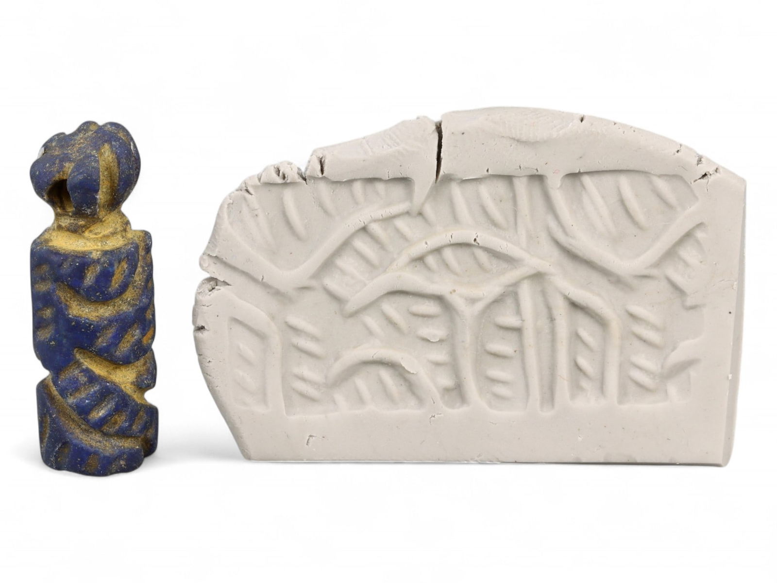 Ancient Elamite Geometric Tree Motif Cylinder Seal in Lapis Lazuli, c. 3rd Millennium BCE, 5g: This rare cylinder seal hails from ancient Elam, a sophisticated civilization that flourished in southwestern Iran contemporaneously with Sumer and Akkad. Intricately carved in lapis lazuli, the desig