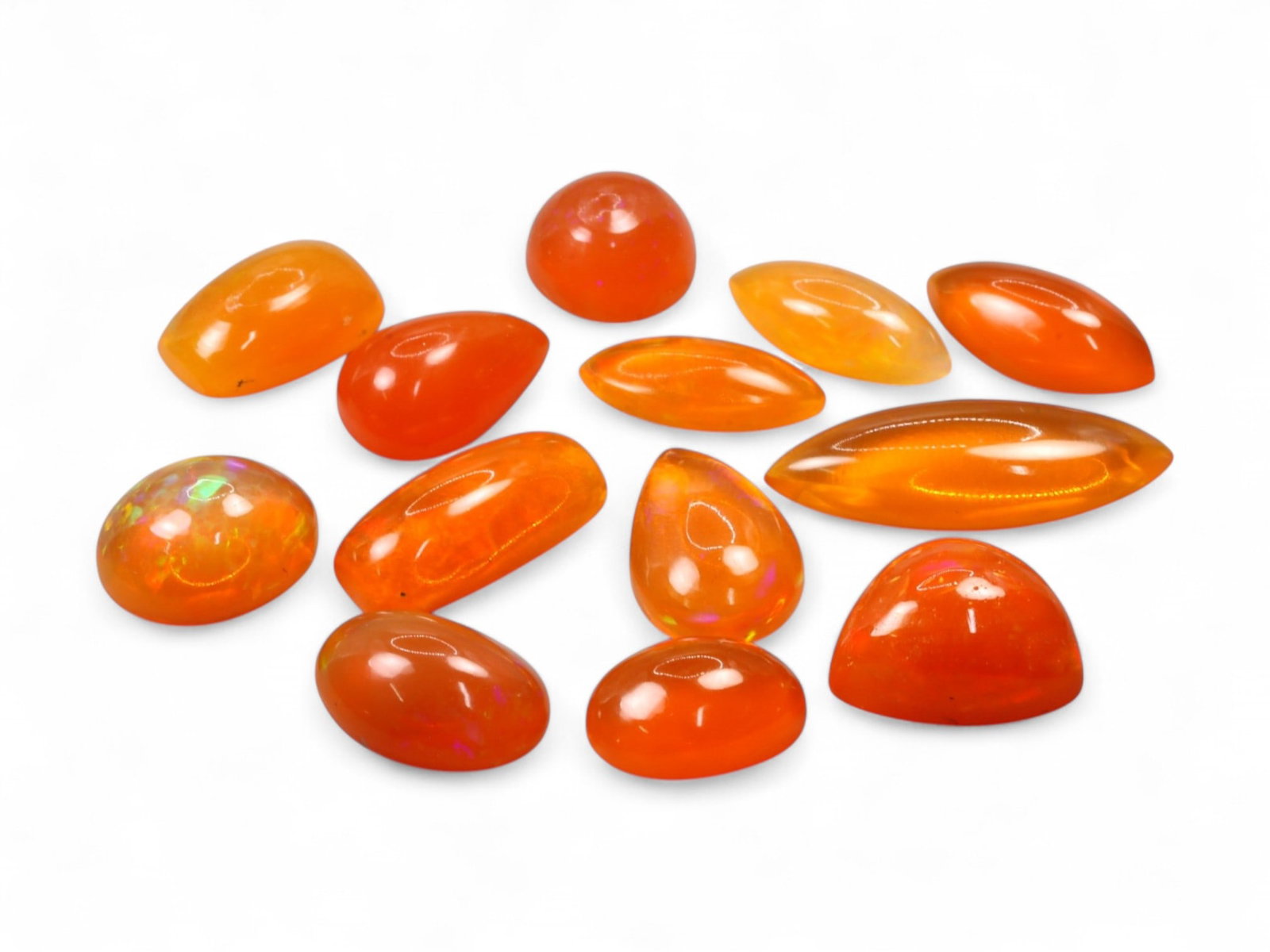 20.15Ct Natural ETHIOPIAN WELO Opal Color-Enhanced Cabochon Parcel: This vivid parcel of Ethiopian Welo opal cabochons bursts with fiery orange hues, the result of expert color enhancement that amplifies their natural translucence. The cabochons are smoothly polished 