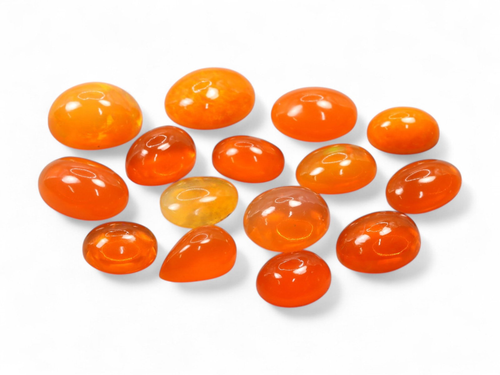 31.80Ct Natural ETHIOPIAN WELO Opal Color-Enhanced Cabochon Parcel: This vivid parcel of Ethiopian Welo opal cabochons bursts with fiery orange hues, the result of expert color enhancement that amplifies their natural translucence. The cabochons are smoothly polished 