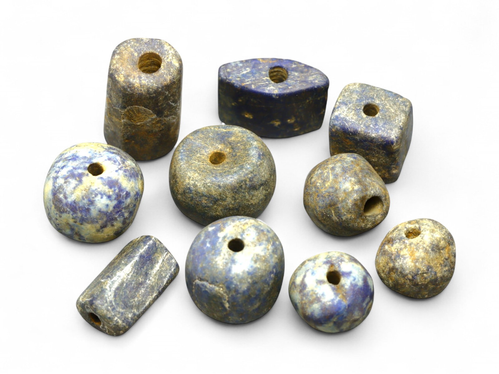 Ancient Bactrian Barrel and Domed Lapis Bead Set, 10pcs, c. 2300-1800 BCE, 39g: This evocative collection of ten lapis lazuli beads originates from the ancient Bactrian civilization of Central Asia, dating from approximately 2300 to 1800 BCE. Weighing a total of 39 grams and rang