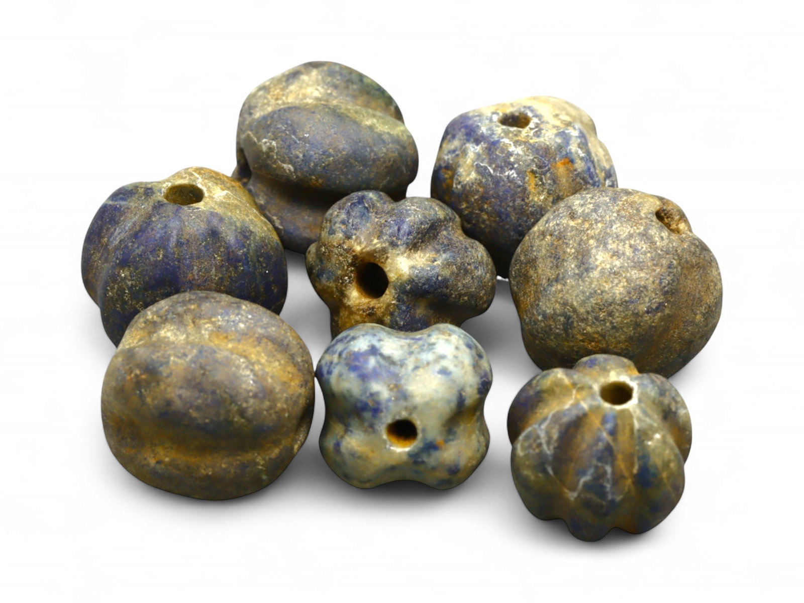 Ancient Egyptian Melon-Shaped Lapis Lazuli Bead Set, c. 18th Dynasty, 24g: This remarkable group of ancient melon-shaped beads, exquisitely carved from lapis lazuli, dates to the Egyptian New Kingdom, likely during the 18th Dynasty (c. 1550-1295 BCE). Their elegant ridged fo