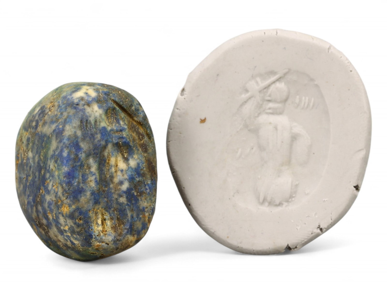 Ancient Neo-Assyrian Heroic Figure Hemispherical Stamp Seal in Lapis Lazuli, 9th-7th Century BCE 22g: This richly hued lapis lazuli hemispherical stamp seal depicts a stylized heroic male figure wielding a weapon, likely a mace or sword, raised in dynamic motion. The seal captures the martial spirit a