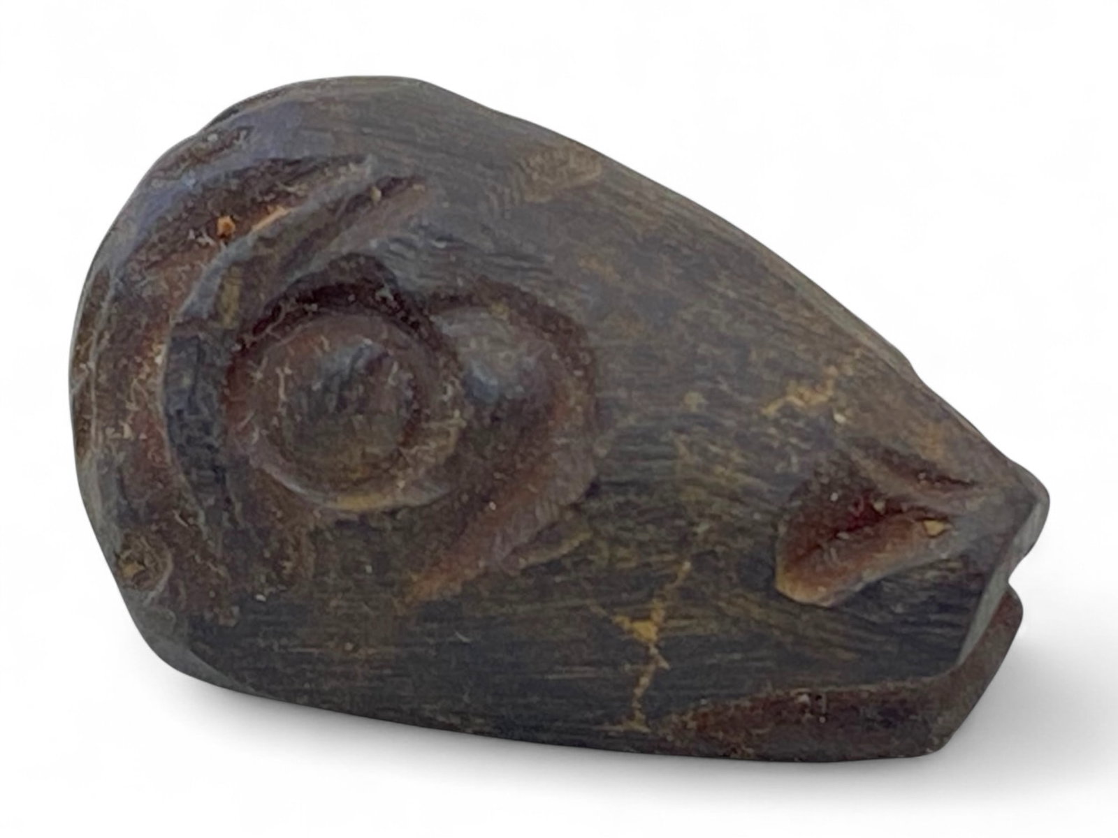 Ancient Mesopotamian Gazelle Head Symbolic Hematite Amulet, c. 2nd Millennium BCE, 9g: This finely carved hematite amulet, depicting the stylized head of a gazelle or goat, originates from ancient Mesopotamia and dates to approximately the 2nd millennium BCE. Measuring 2.5 cm (0.98 inch
