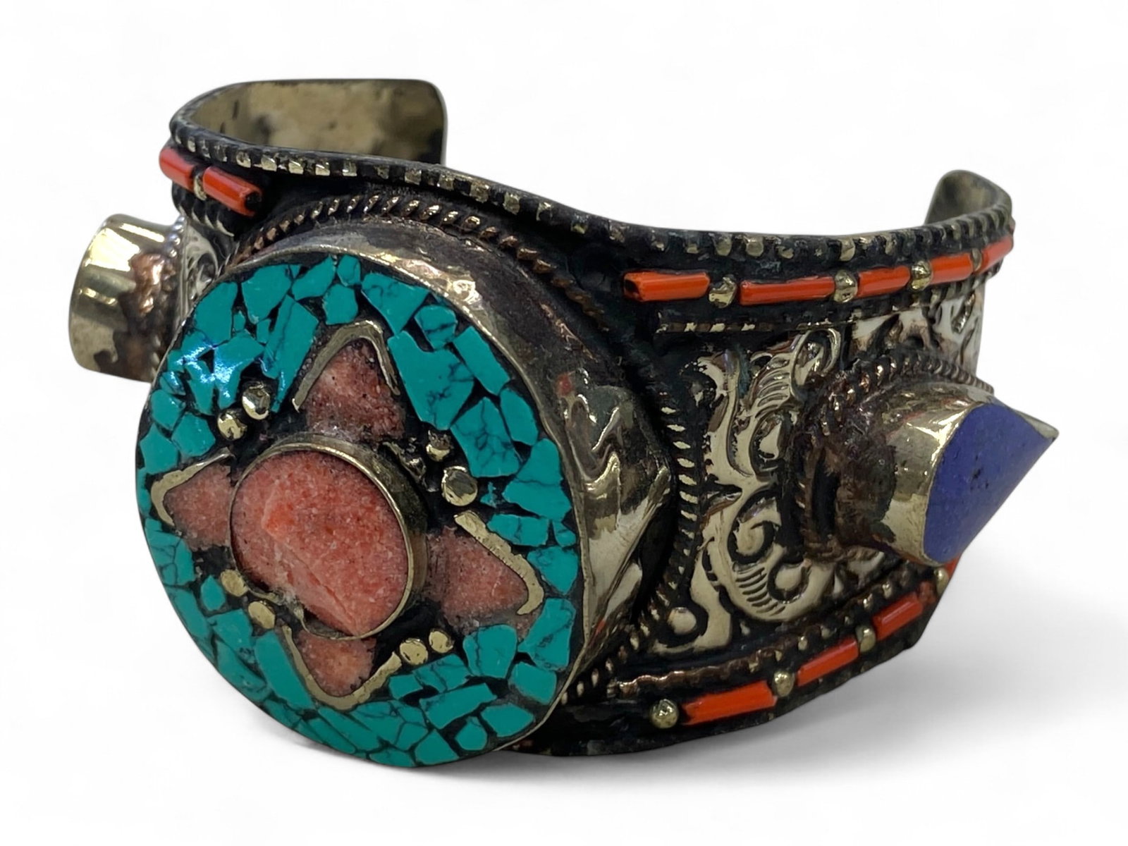 Antique Himalayan Turquoise Coral Lapis Ritual Cuff Bracelet, c. 19th-20th Century, 115g: This vibrant and boldly constructed antique cuff bracelet reflects the rich spiritual and artistic traditions of the Himalayan region, likely Nepal or Tibet, dating from the late 19th to early 20th ce
