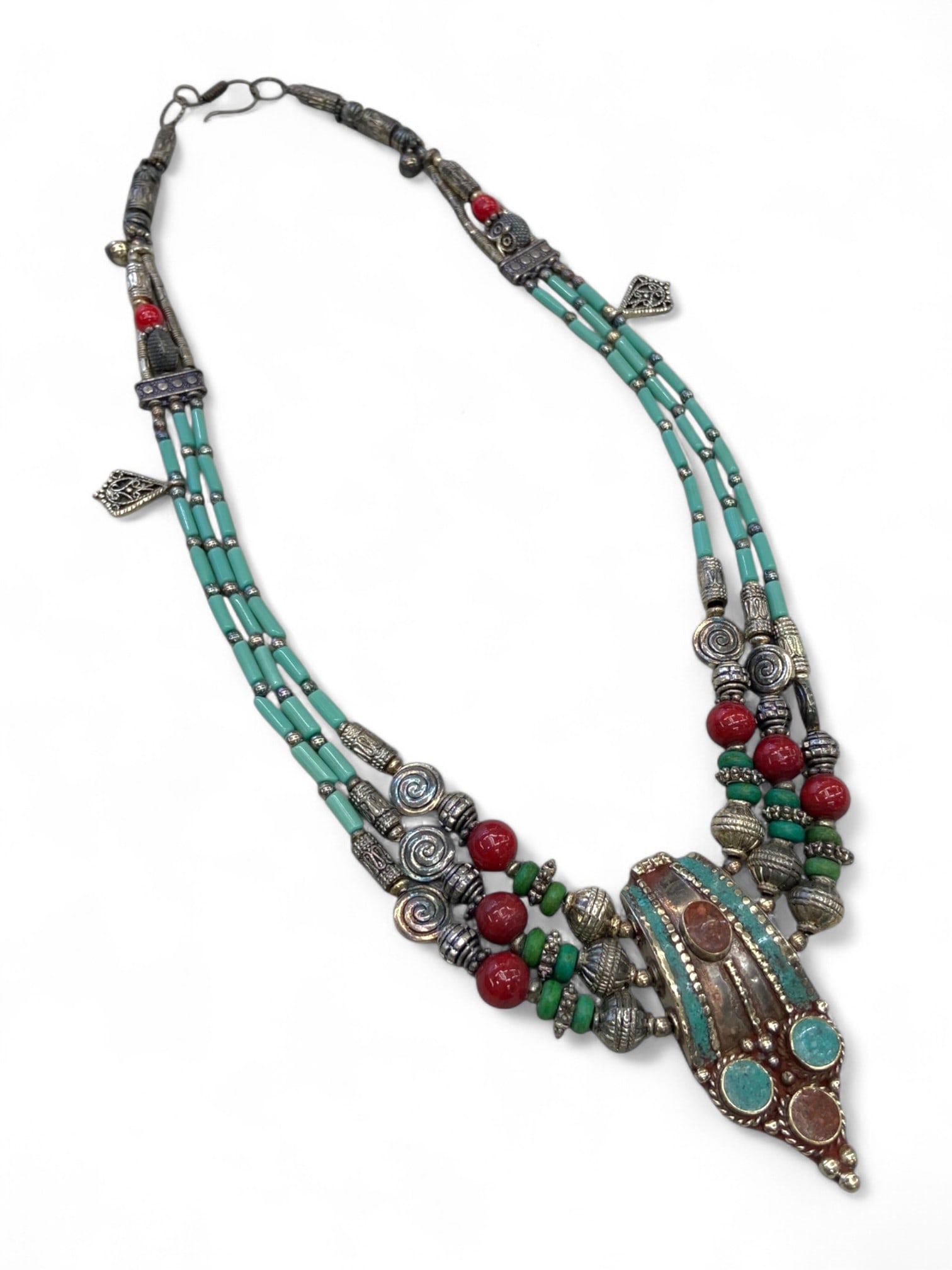 Antique Central Asian Amulet Necklace with Turquoise, Carnelian, and Tribal Silverwork, 121g: This striking antique necklace from Central Asia reflects a vibrant fusion of ethnic artistry, spiritual symbolism, and age-worn elegance. At its center lies a protective amulet pendant - likely worn 