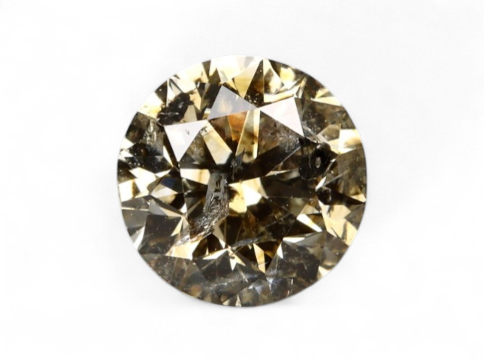0.54Ct Natural Matrix Earth-Tone Round Brilliant Diamond, 5.1mm: A bold expression of natural inclusions and warm mineral tone, this round brilliant diamond features a richly mottled surface of coffee, slate, and silvery flecks. The internal matrix gives the stone 