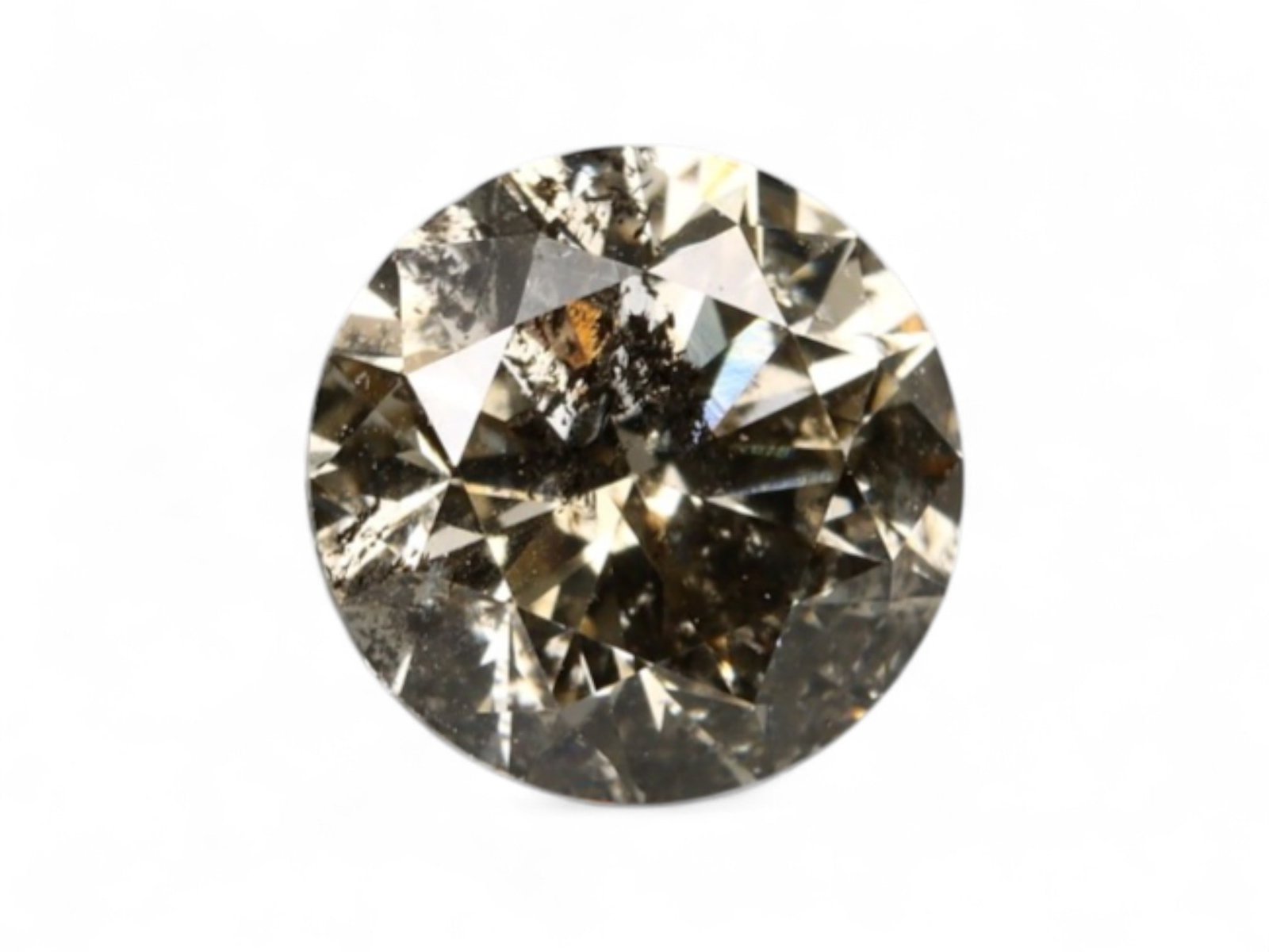 0.57Ct Natural Matrix Earth-Tone Round Brilliant Diamond, 5.2mm: A bold expression of natural inclusions and warm mineral tone, this round brilliant diamond features a richly mottled surface of coffee, slate, and silvery flecks. The internal matrix gives the stone 