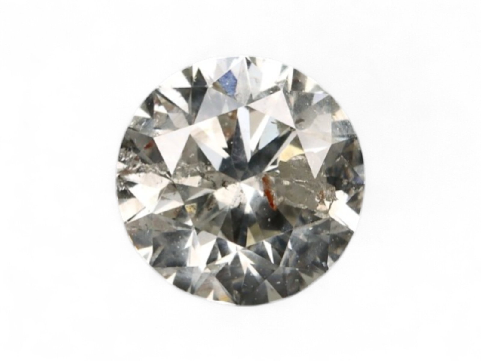 0.47Ct Natural Matrix Earth-Tone Round Brilliant Diamond, 4.8mm: A bold expression of natural inclusions and warm mineral tone, this round brilliant diamond features a richly mottled surface of coffee, slate, and silvery flecks. The internal matrix gives the stone 