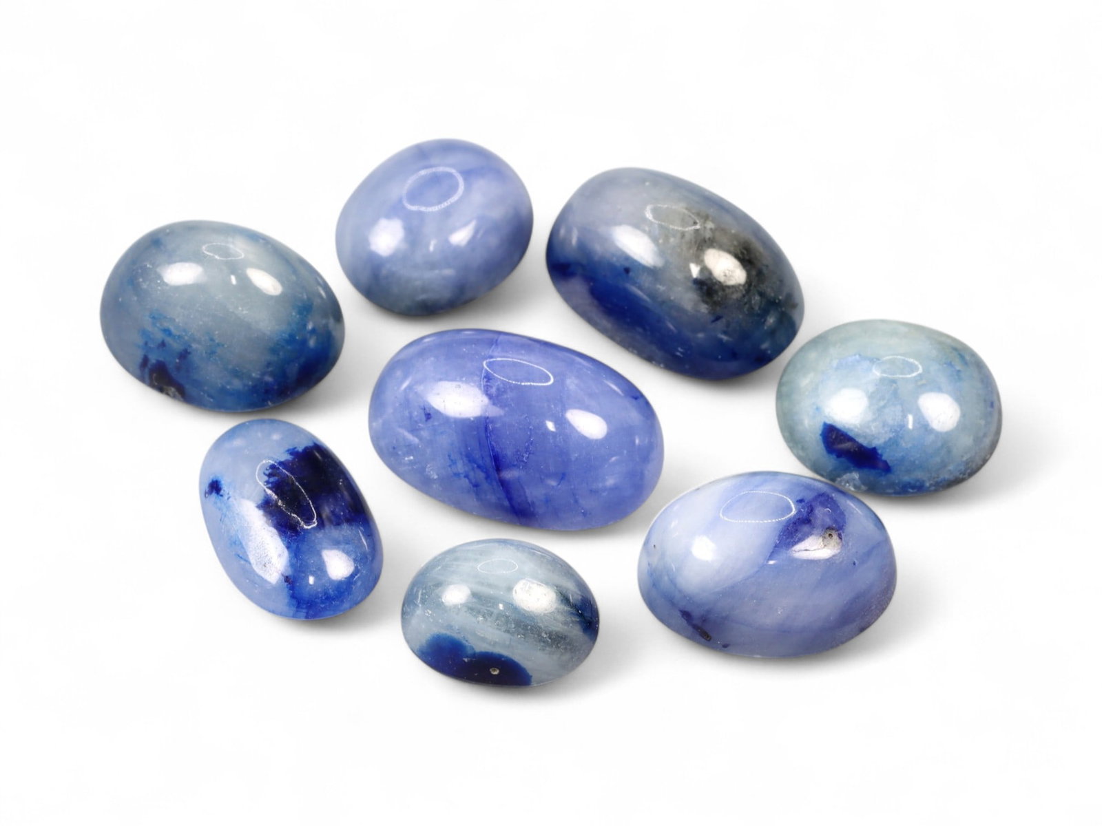 49.07 Carats Blue to Indigo Sapphire Cabochon Lot - Natural Sri Lankan Stones: This striking parcel of sapphire cabochons showcases an alluring spectrum of blues-from denim and sky to inky navy and violet-washed indigo. The stones are domed and smoothly polished, revealing a sil