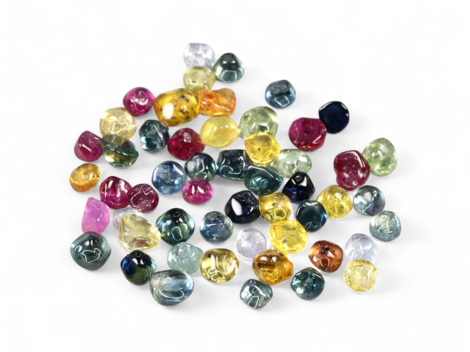 11.49 Carats Polished Fancy Sapphire Selection - Natural Madagascar Stones: This captivating lot of sapphires stands out for its rare, organically polished finish that retains much of the gems' original form while amplifying their inherent brilliance. Each piece is individual
