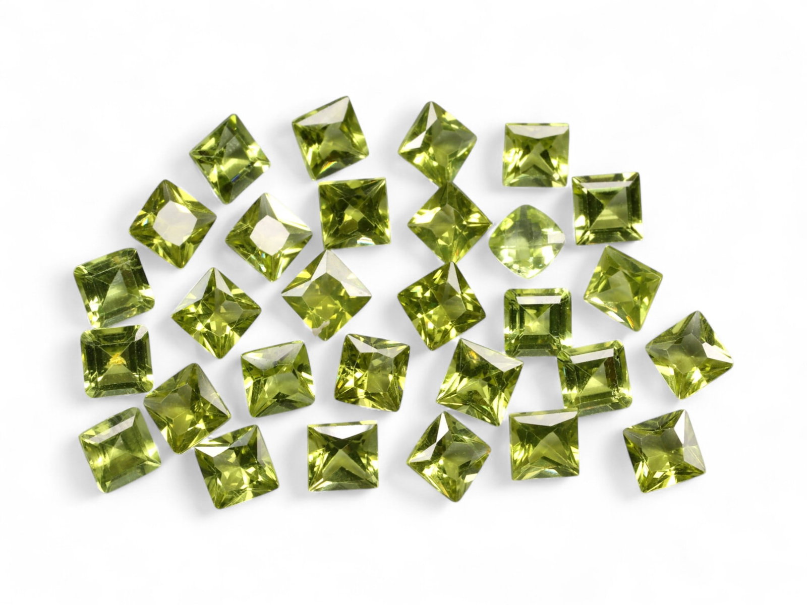 20.46 Carats Lime Green Peridot Square Lot - Natural Pakistani Stones: A vibrant collection of precision-cut peridot gems, this parcel radiates fresh lime and golden-chartreuse tones under the light. Each square-cut stone boasts sharp faceting and lively brilliance, with