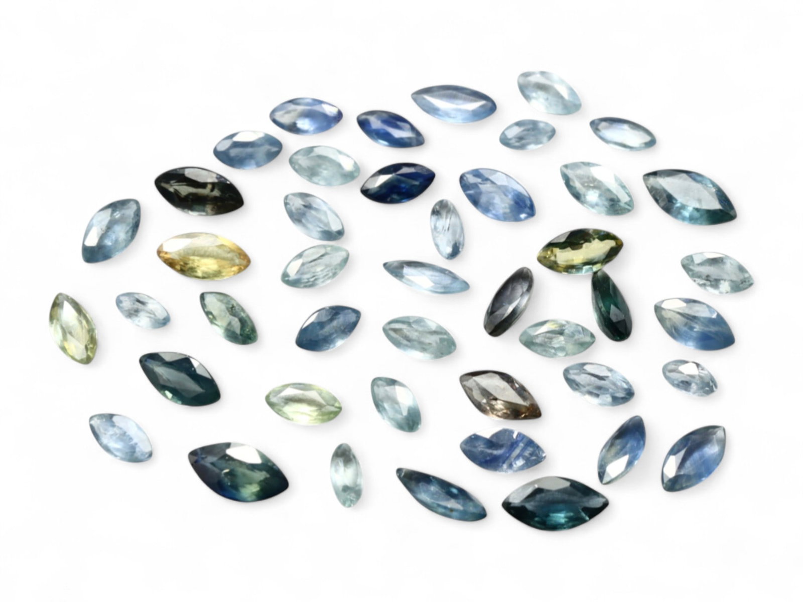10.43 Carats Marquise-Cut Sapphire Selection - Natural Sri Lankan Stones: This sophisticated assortment of marquise-cut sapphires spans a refined palette of blues, greens, and silvery tones, evoking cool twilight skies and oceanic depths. With a combined weight of 10.43 car