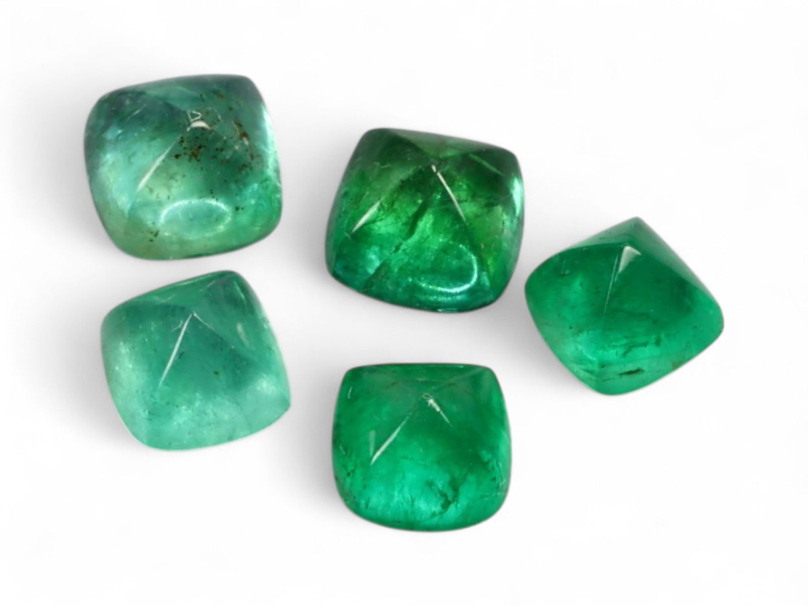 2.34 Carats Soft to Vivid Green Emerald Sugarloaf Lot - Natural Colombian Stones: This charming group of five sugarloaf-cut emeralds features a delicate range of green hues, from gentle mint and seafoam to rich forest and medium bottle green. Each stone is smoothly domed with a def