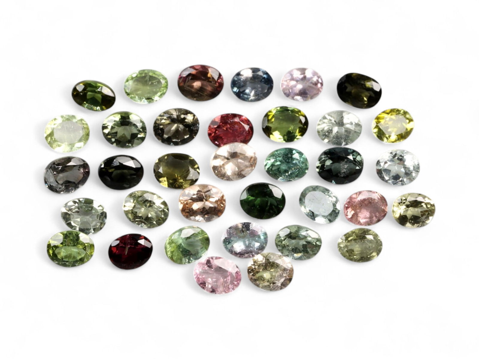11.65 Carats Mixed Color Tourmaline Lot - Natural Afghan Stones: A vibrant display of tourmaline diversity, this 11.65 carat parcel presents a kaleidoscope of natural hues-pastel pinks, silvery greens, rich rubellite tones, olive, lemon-lime, and soft smoky neutral