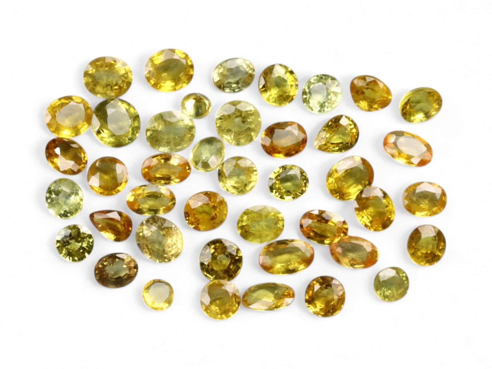 12.14 Carats Golden Yellow Sapphire Lot - Natural Sri Lankan Stones: This radiant lot of sapphires captures a spectrum of yellow tones-from golden sunrise and canary to warm amber and lime-tinged citrus. Weighing a total of 12.14 carats, the selection features well-cut