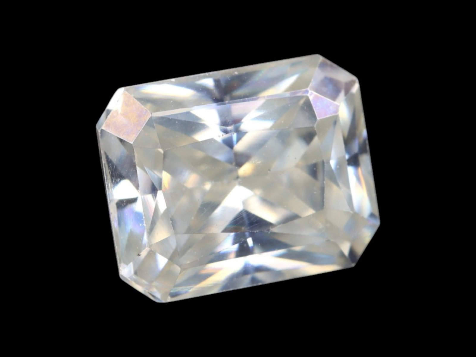 2.95 Carats Near-Colorless Moissanite Emerald Cut - Precision Step Faceting: This emerald-cut moissanite offers timeless elegance through clean step facets and sharp symmetry. Its near-colorless body displays brilliant clarity with subtle prismatic flashes under light, creatin
