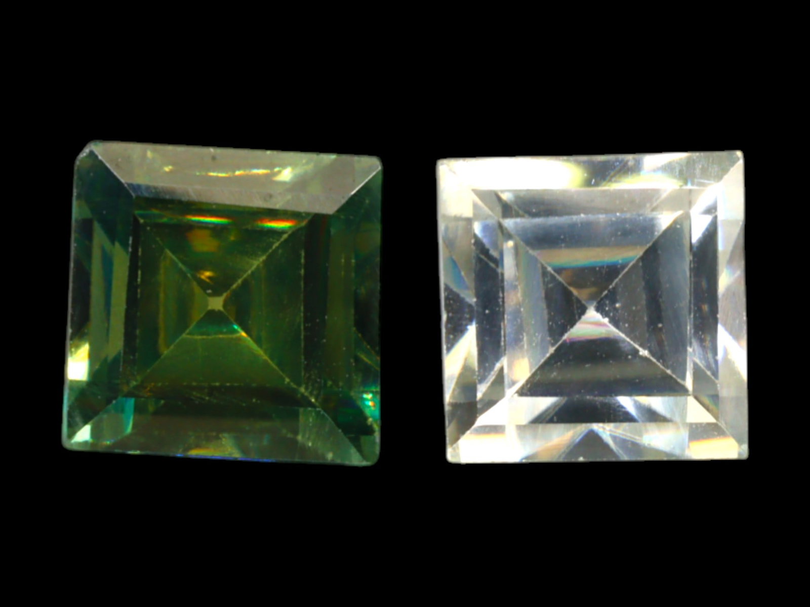 6.79 Carats Bi-Color Moissanite Square Pair - Precision Step Cut: This 6.79-carat duo of square step-cut moissanites offers a bold contrast in tone and brilliance. One gem showcases a vivid forest-green hue with golden undertones, while the other remains near-colorl