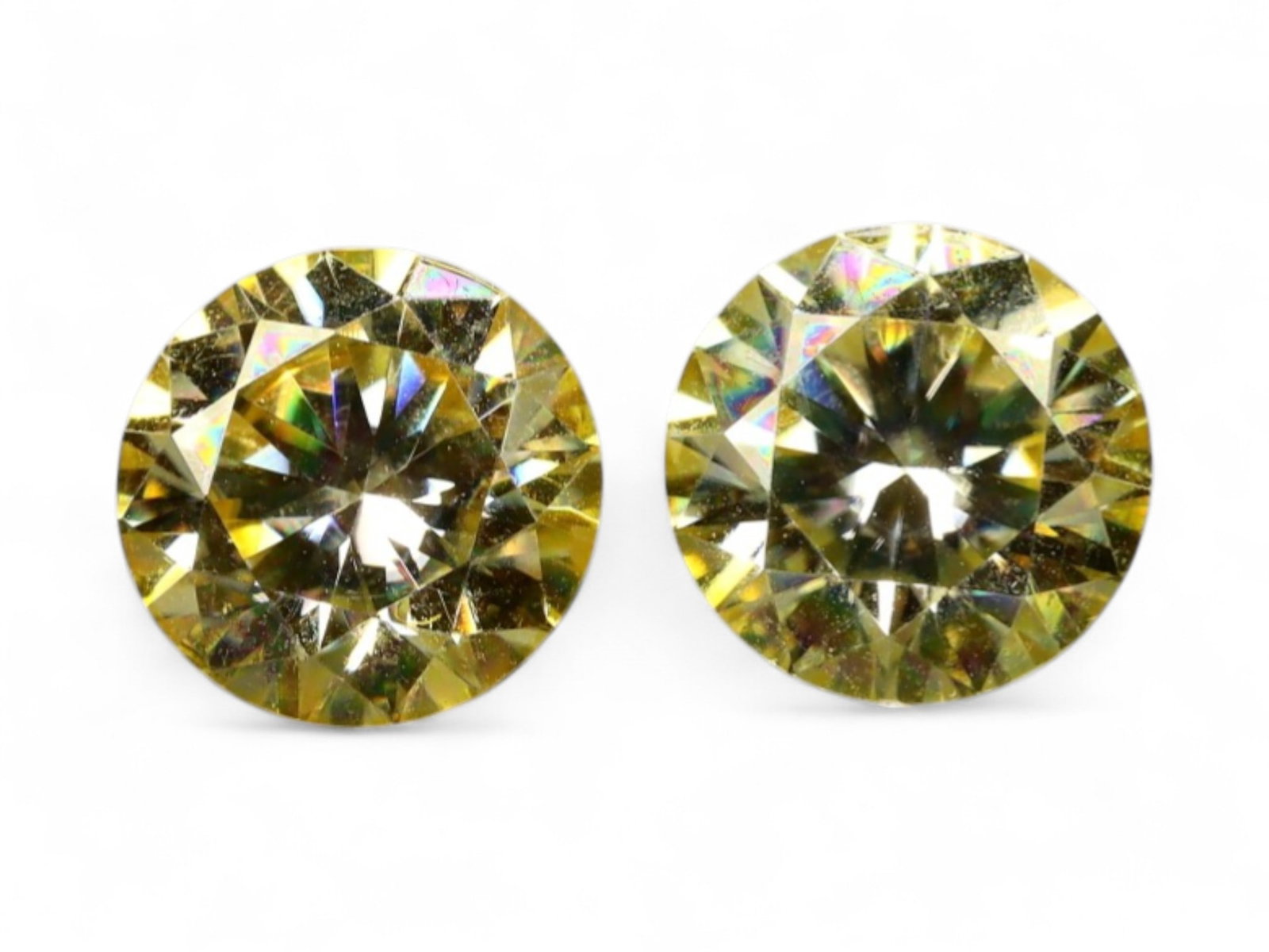 1.92 Carats Vivid Yellow Moissanite Pair - Precision Round Brilliant Cut: This radiant pair of round brilliant moissanites captures the eye with a burst of golden fire and unmistakable sparkle. Their vivid yellow tone is evenly distributed and richly saturated, delivering h