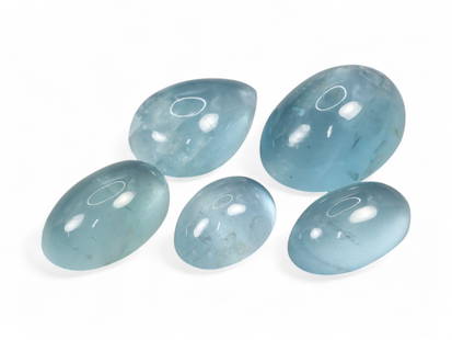 44.00 Carats Sky Blue Aquamarine Cabochon Lot - Natural Brazilian Stones: This tranquil parcel of aquamarine cabochons exudes a soft, serene sky blue hue that evokes calm seas and open skies. The domed, polished surfaces highlight the natural translucency of the stones, off