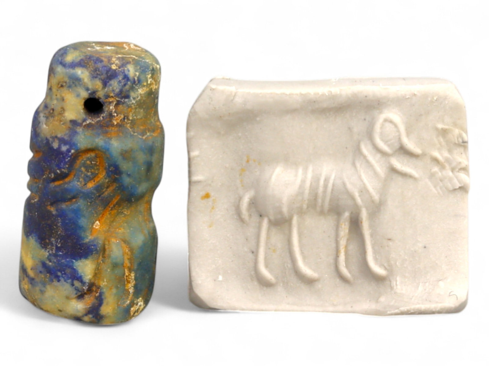 Ancient Elamite Ram and Offering Cylinder Seal in Lapis Lazuli, c. 2500-1800 BCE, 3.7g: This powerful Elamite cylinder seal, sculpted in vivid blue lapis lazuli, dates to the period of Elamite-Indus interaction between 2500 and 1800 BCE. Measuring 2 cm in height and 1 cm in diameter (app