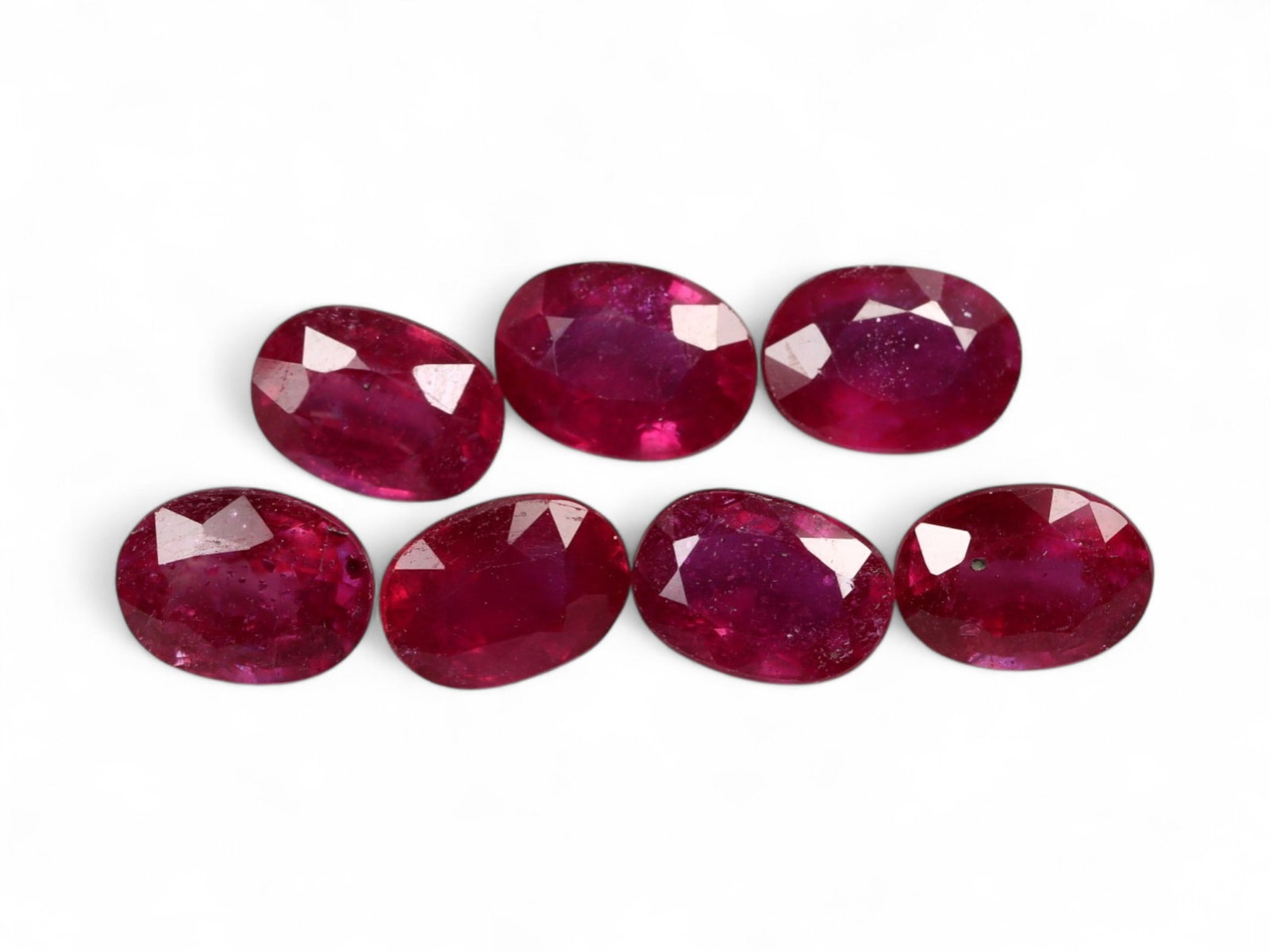 8.50 Carats Deep Red Ruby Oval Lot - Natural Mozambique Stones: This striking ruby parcel glows with rich crimson and velvety scarlet tones, capturing the timeless allure that makes rubies one of the most coveted colored gemstones. Each stone is cut in a classic o