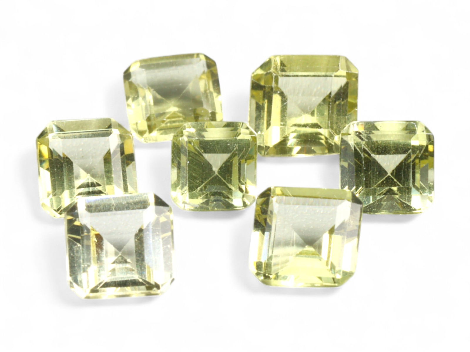 6.28 Carats Lemon Yellow Apatite Parcel - Natural Madagascar Stones: This vibrant parcel of lemon yellow apatite dazzles with its crystalline transparency and precision square step cuts. Each gem displays a radiant pale-to-medium yellow tone, offering a refreshing, cit