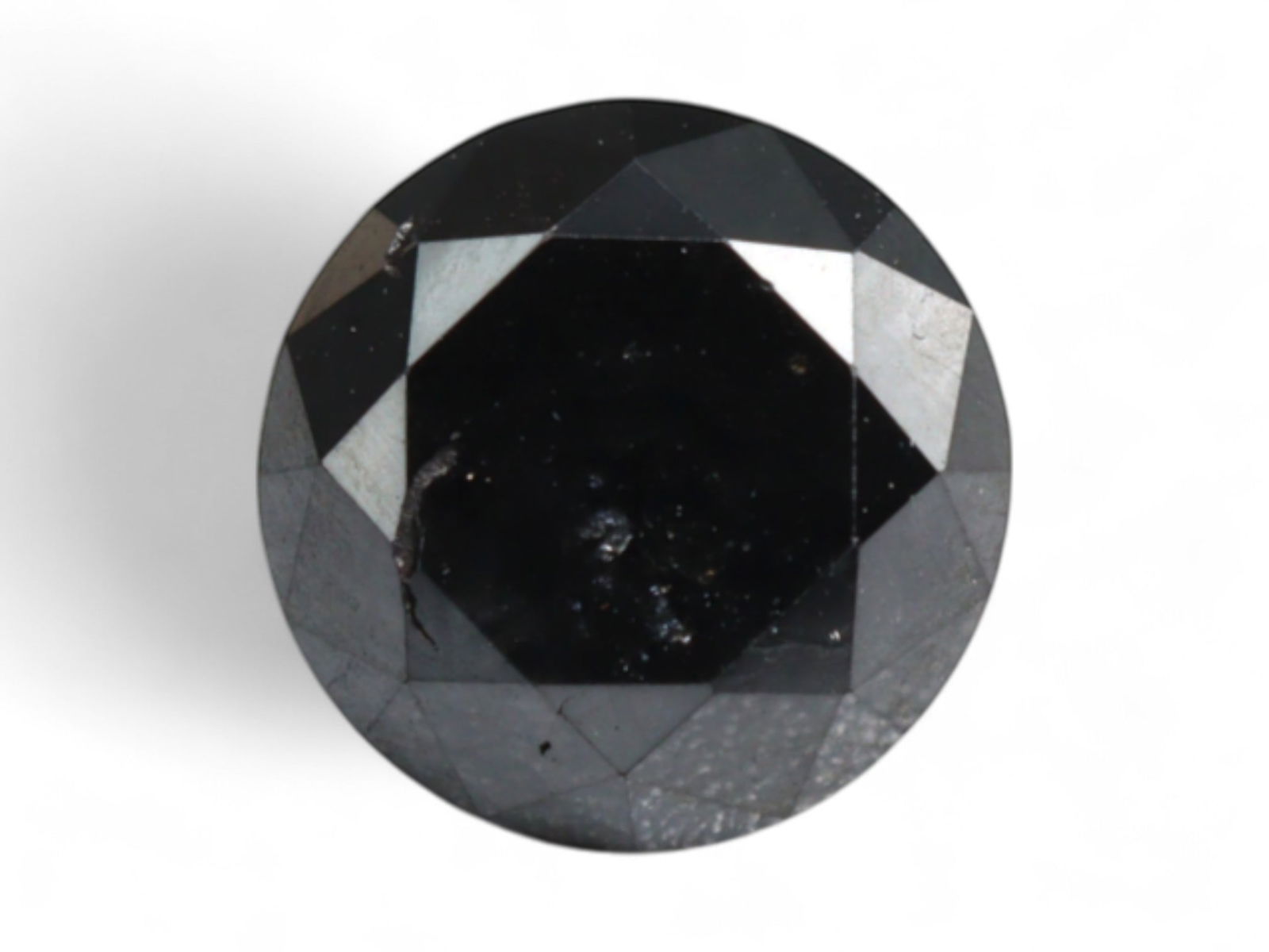 1.51 Carats Jet Black Diamond - Round Cut Natural Stone: This bold round-cut diamond exudes strength and modern edge with its deep, jet black tone and glossy faceted surface. The stone presents commanding presence, ideal for use in both minimalist and state