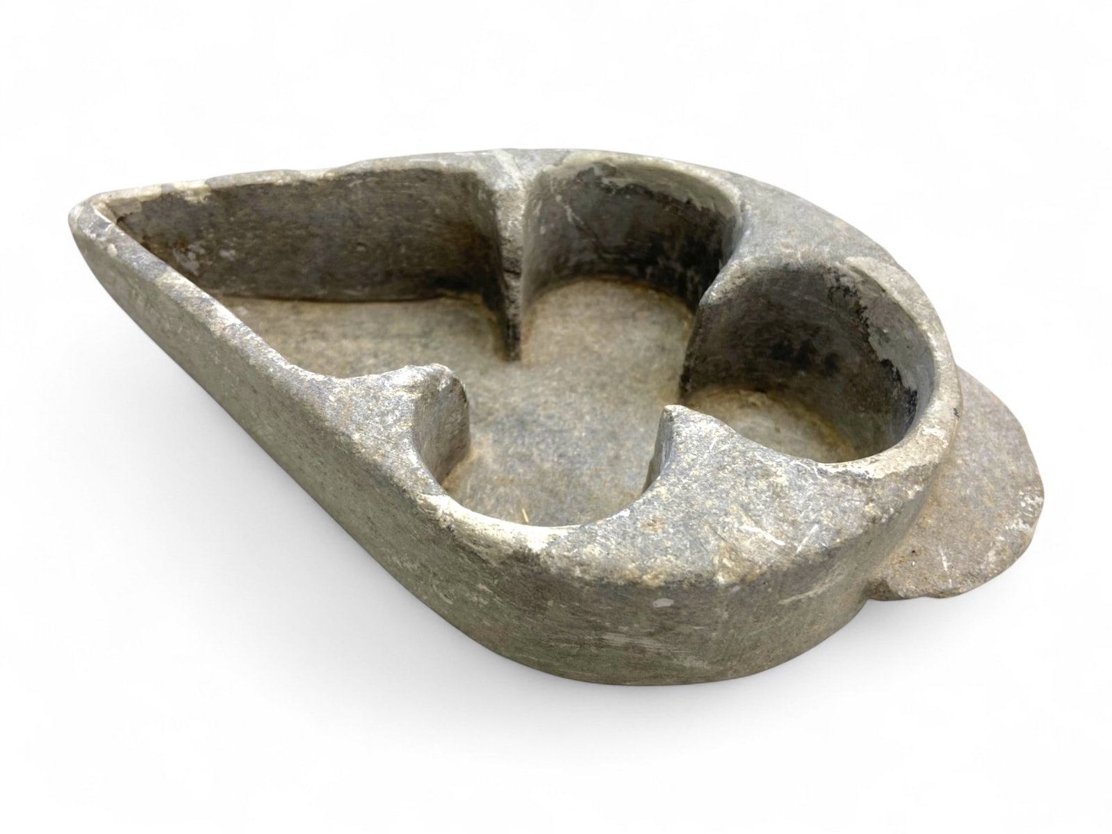 Ancient Bactrian Ritual Compartmentalized Schist Bowl, c. 3rd-2nd Millennium BCE, 495g: Carved from a single piece of dark schist, this extraordinary Bactrian artifact from the 3rd-2nd millennium BCE showcases an innovative and refined design-a teardrop-shaped bowl internally divided int