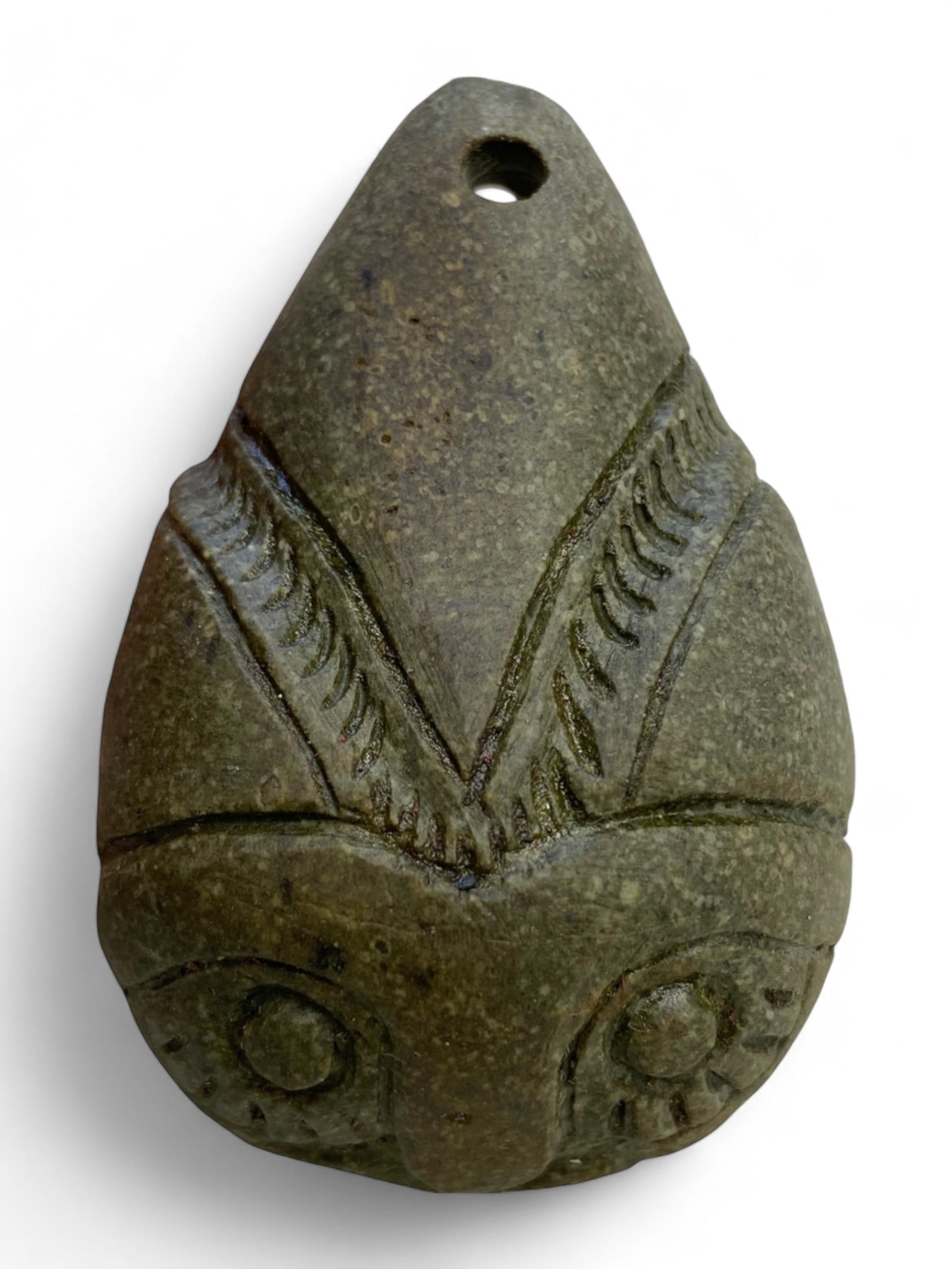 Ancient Medieval Owl-Eyed Guardian Amulet Pendant in Green Stone, c. 10th-13th Century CE, 109g: This powerful and enigmatic amulet pendant, carved from a deep green stone, likely dates from the 10th to 13th century CE and reflects the magical and protective beliefs that permeated medieval life. 