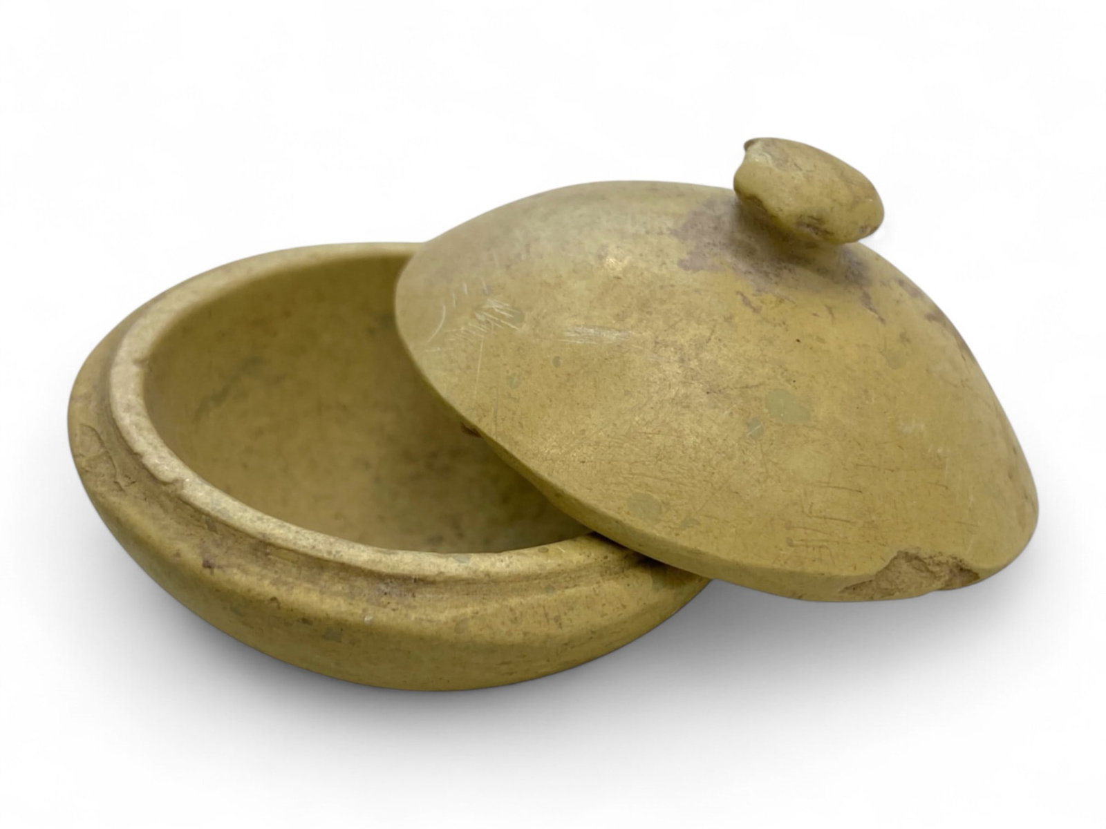 Ancient Harappan Lidded Steatite Cosmetic Vessel, c. 3rd Millennium BCE, 67g: This elegant cosmetic vessel hails from the sophisticated Harappan civilization, dating to the 3rd millennium BCE. Expertly carved from steatite, the vessel includes a domed lid with a smooth, central