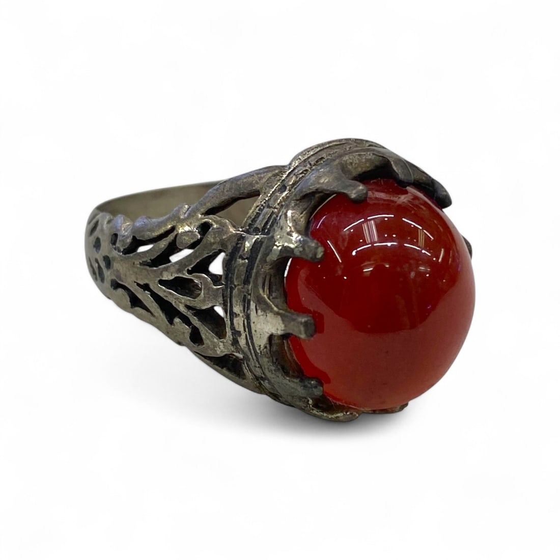 Antique Ottoman Revival Filigree Claw Carnelian Silver Ring, c. Early 20th Century, 8g, US 10: This captivating silver ring from the early 20th-century Ottoman Revival period features a bold, high-domed carnelian cabochon, embraced by a dramatic claw-style bezel. The prongs resemble curling fla